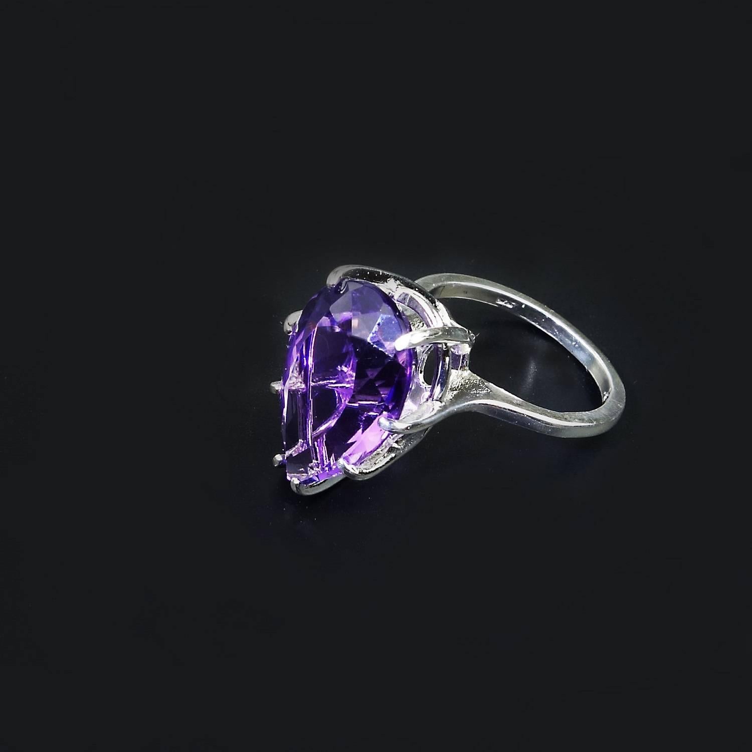 Custom made flashing Brazilian Pear shaped Amethyst set in Basket Style Sterling Silver ring.  This 10.85 carat Gemstone is a joy to wear.  This stunning gemstone came from our favorite supplier in the mountains outside of Rio de Janeiro. Amethysts