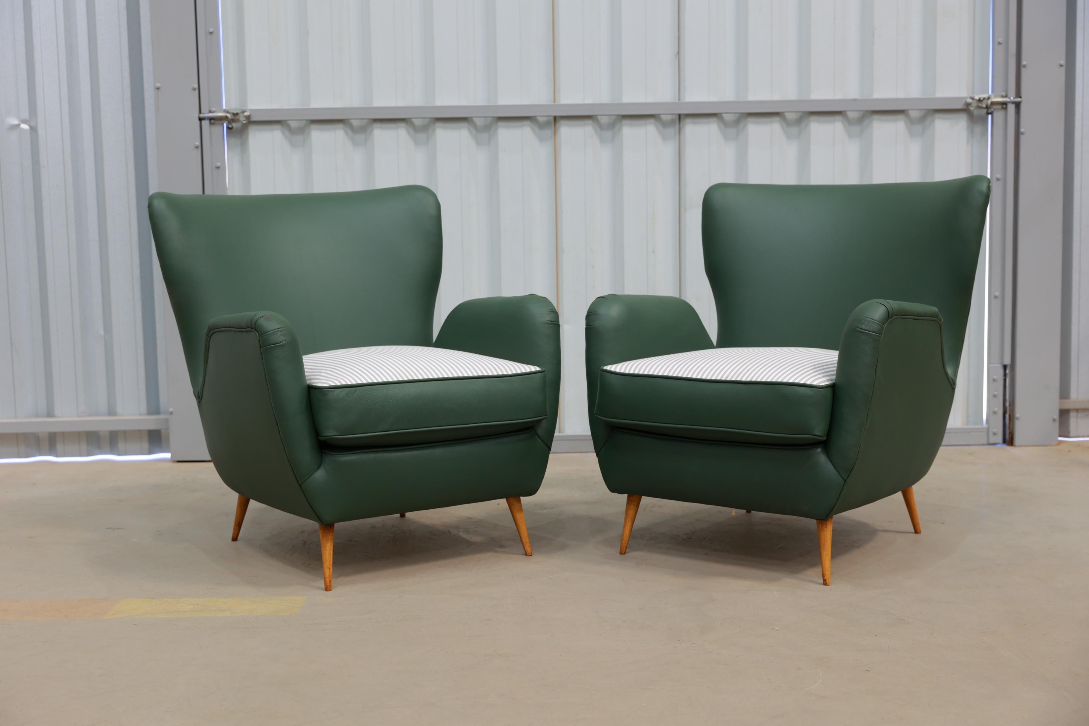 Available today, with domestic shipping in the NYC metro area included, these Brazilian Mid-Century Armchairs with Pouf in Hardwood, Leather and Fabric, Carlo Hauner, c. 1950s, is nothing less than gorgeous! 

This set of armchairs with a matching