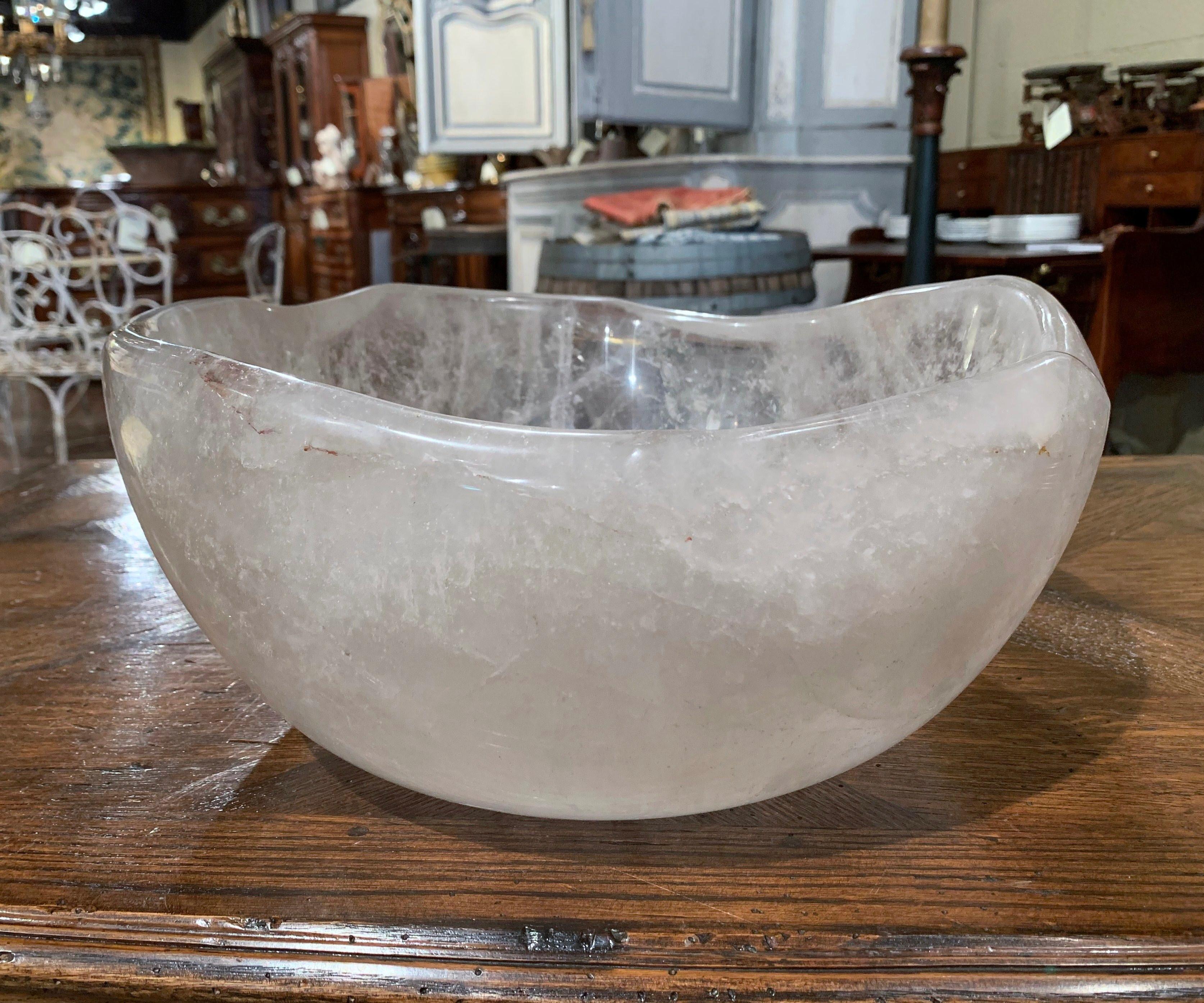 This large carved rock crystal center bowl was crafted in Brazil; the heavy bowl with scalloped edges is in excellent condition with a rich patinated finish.
Measures: 13.25