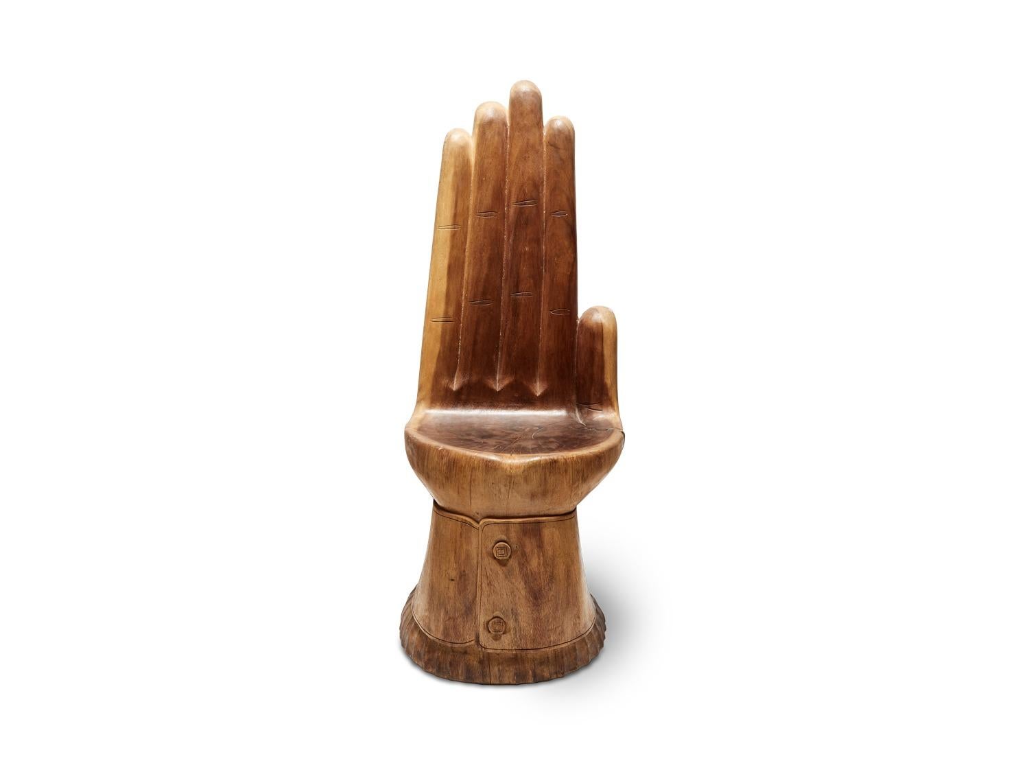 Brazilian carved wood hand chair (circa 1960s).

Dimensions: 17 W, 20 D, 42 H

Seat height 18 H.