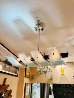 Lampadario brasiliano in Jacaranda, vetro e metallo Joaquim Tenreiro 1970.