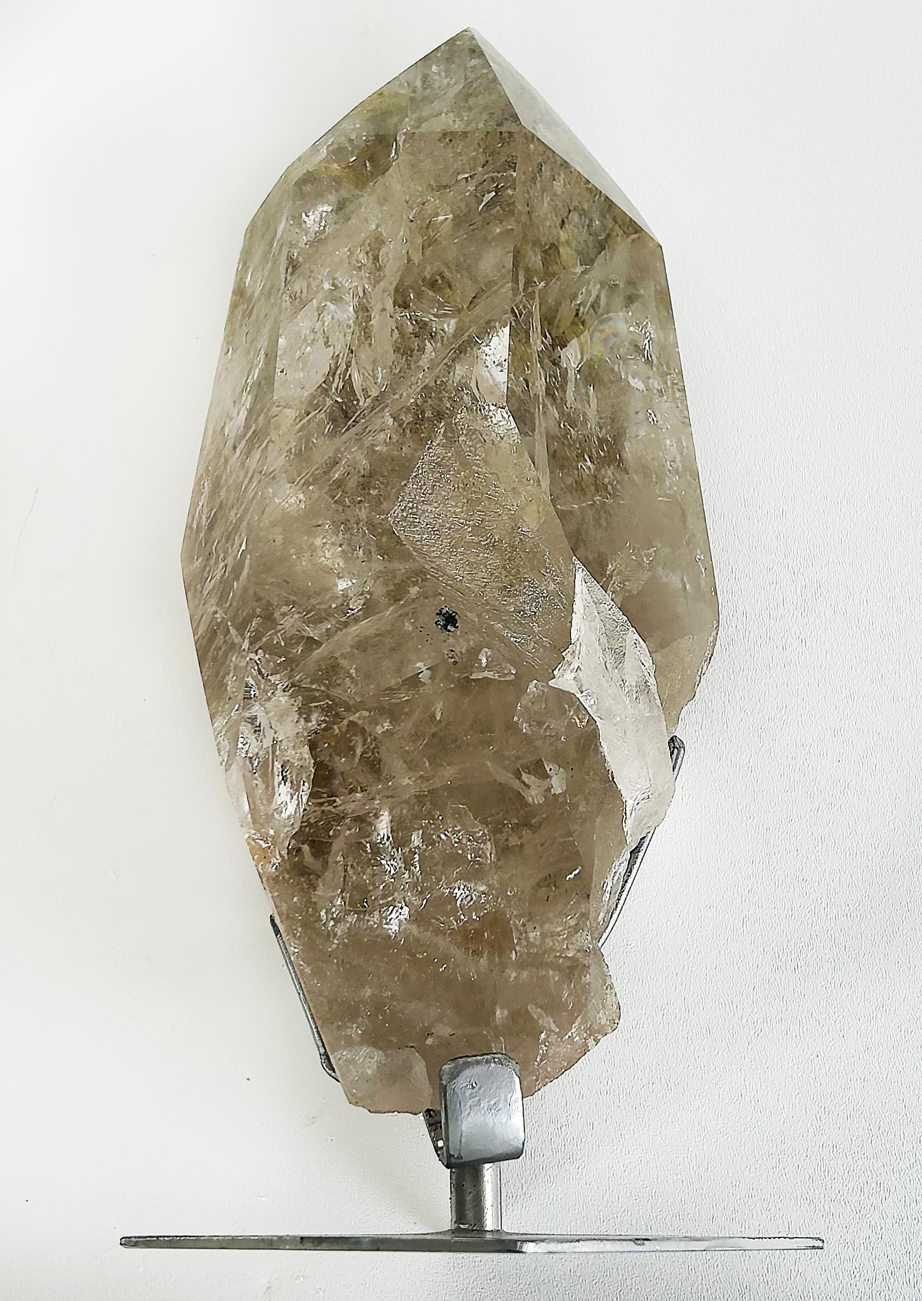 Brazilian Chlorite Garden Quartz Crystal Weighing 19lbs. on Custom Made Stand

Offered for sale is a large specimen of Brazilian garden quartz which is clear quartz that is accented with natural inclusions of mossy chlorite that gets caught in the