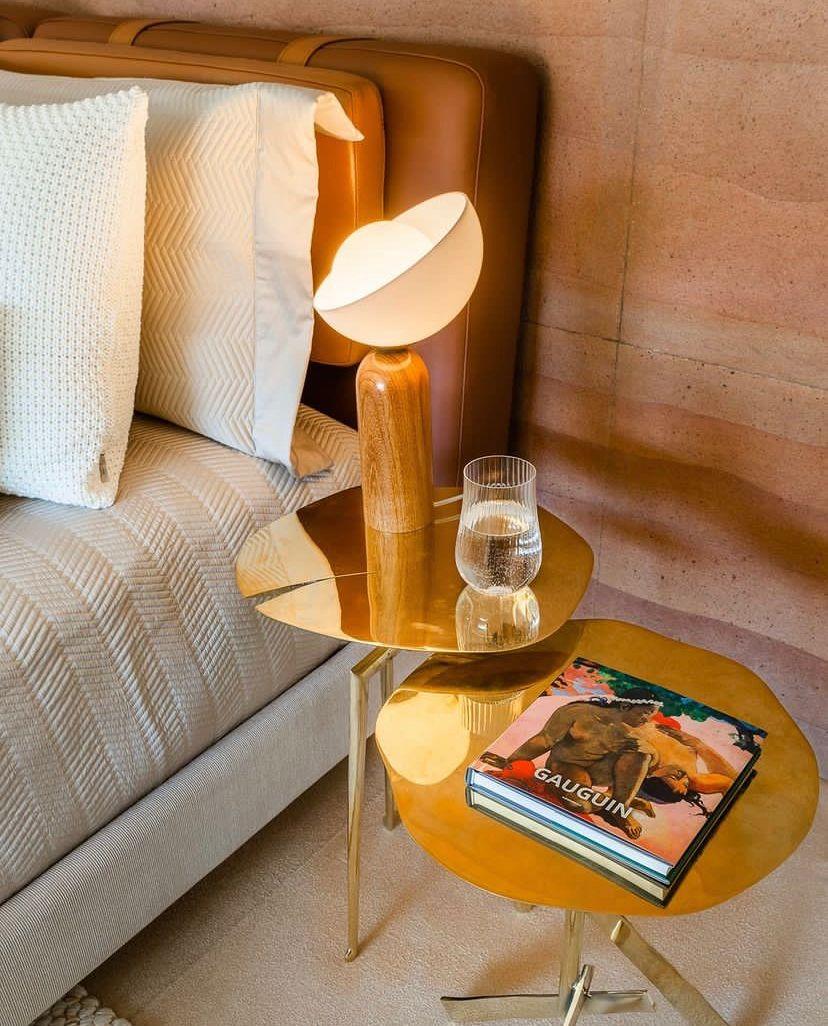 This table lamp is named Lichia. 
The product consists of a round acrylic diffuser and a wooden base.
The base is made of wood, shaped in a rounded design and with a varnish finishing, which gives the piece a shiny aspect.
The diffuser is made of