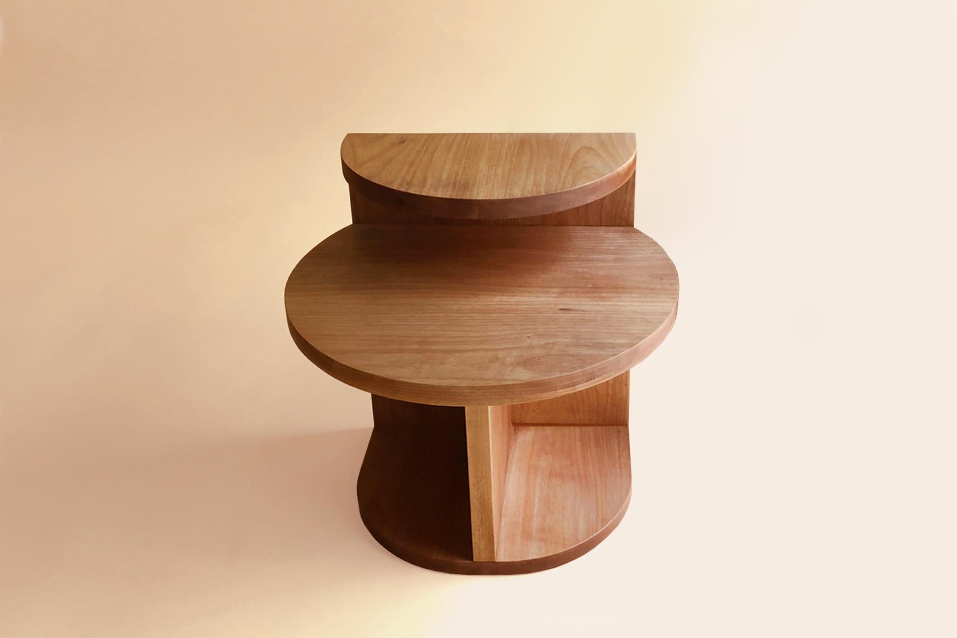 The café side table has simple geometric shapes. Its contemporary design includes with two circular shaped tops and two levels of height make the table a versatile piece that can be used as a coffee table or side table; and in composition with 02
