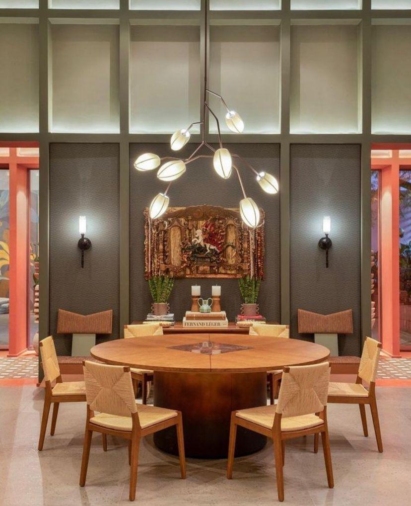 This pendant is named Sacurá Max. It is a Sculptural light pendant in brass with natural finish without varnish. The finish on this sculptural pendant light darkens over time. The mall cotton domes in various colors.

The design of this pendant
