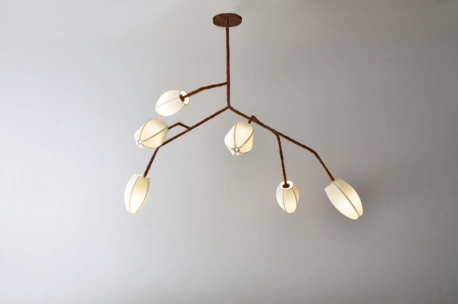 This pendant is named Sacurá Max. It is a Sculptural light pendant in steel. It can be paited in black, white ou brown (corten). It has 6 domes. The mall cotton domes in various colors.

The design of this pendant light is based on cherry trees with