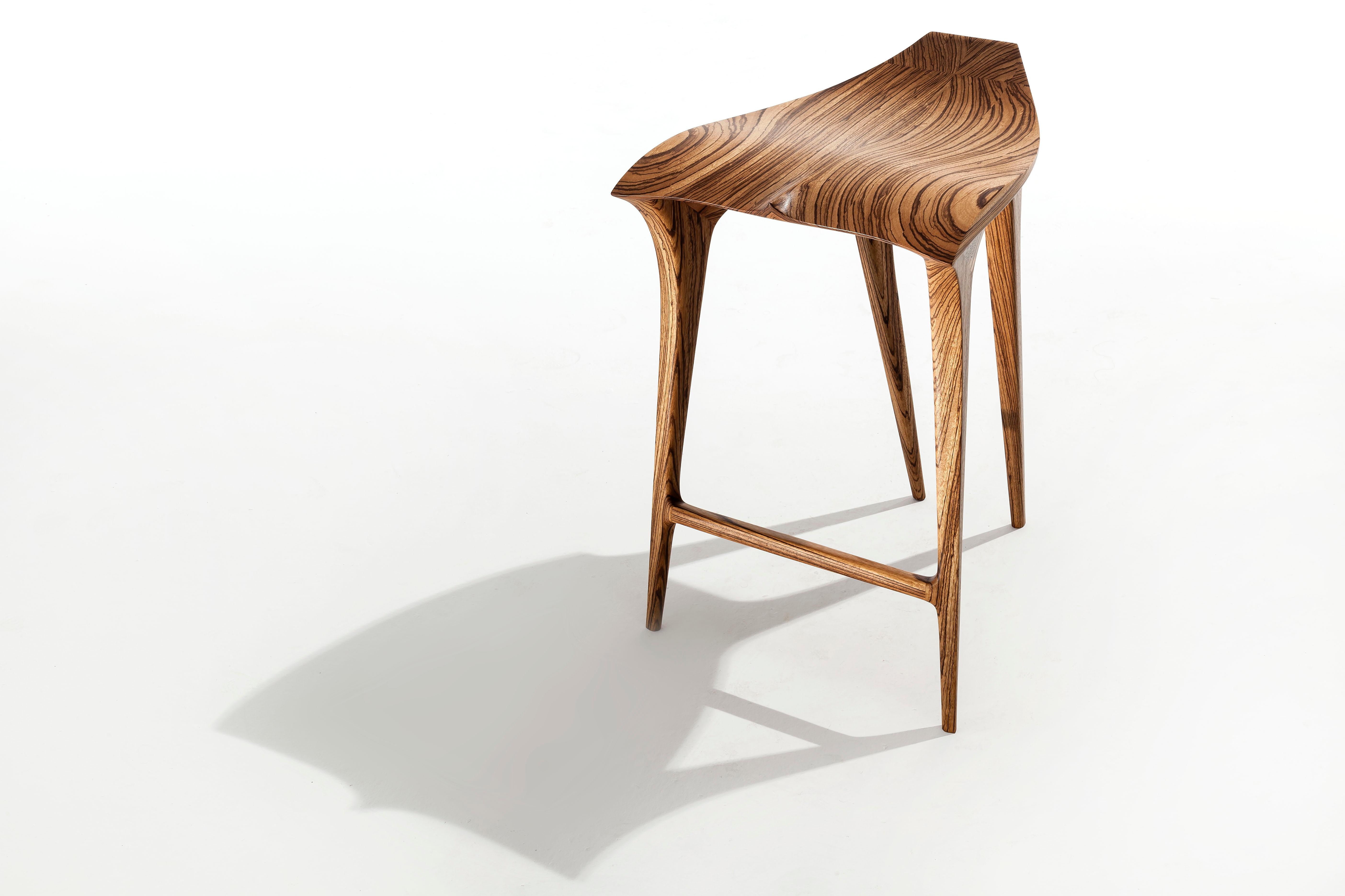 The Barba Negra stool was created as an interpretation of the sensations aroused by the contact with the marine universe that generated a curvilinear, fluid and dynamic design of the piece. 

The solid wood is cut into several parts to be better