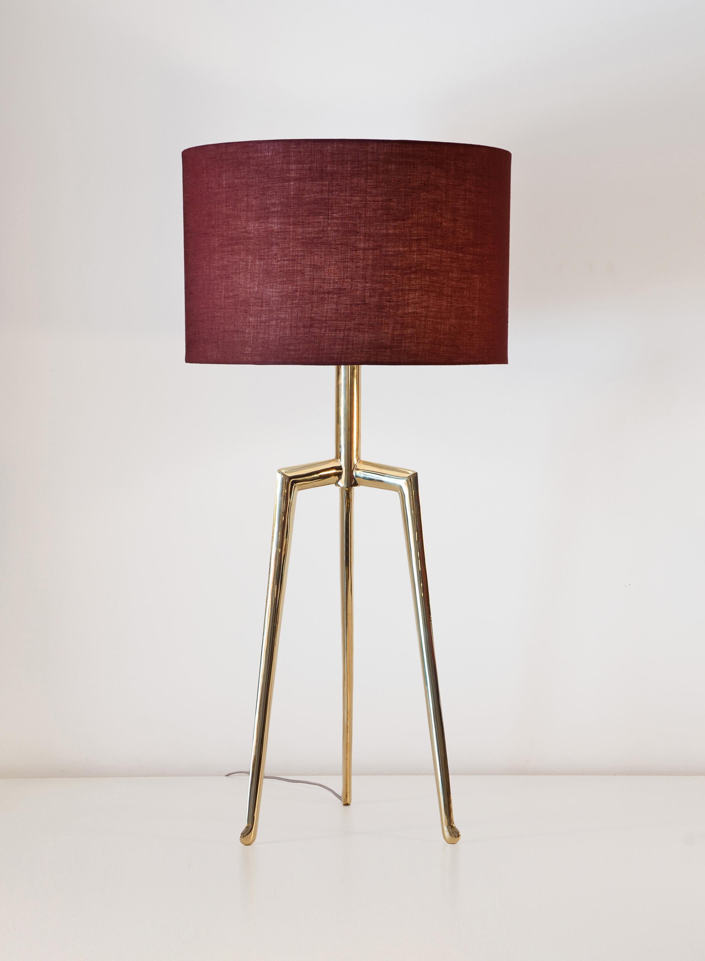 Sita. table lamp - Stylish and useful cast bronze tablelamp with contemporary design. The dome is made of cotton and it can be in various collors. 
The base presents natural irregularities of the productive process. 
It is available in two