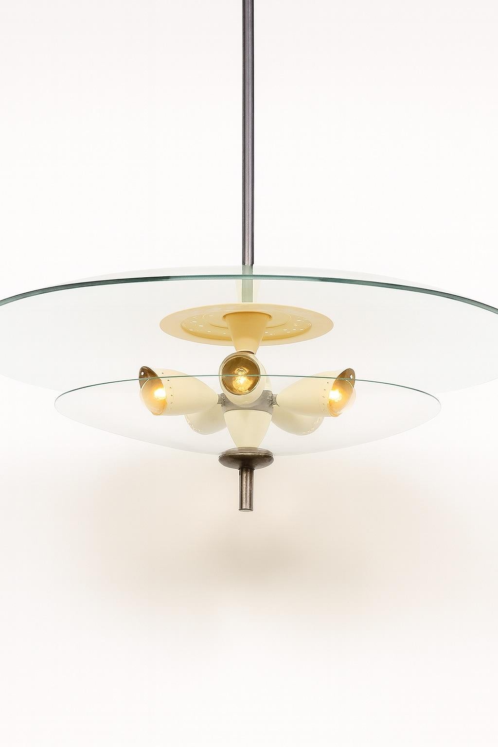 Design Brésilien
Five-light pendant , c. 1960
Historical Piece
Metal, painted metal and glass
75 x 75 x 70 cm
29 53/100 x 27 14/25 in

Created circa 1960, this five-light pendant exemplifies the elegance and inventiveness of Brazilian modernist