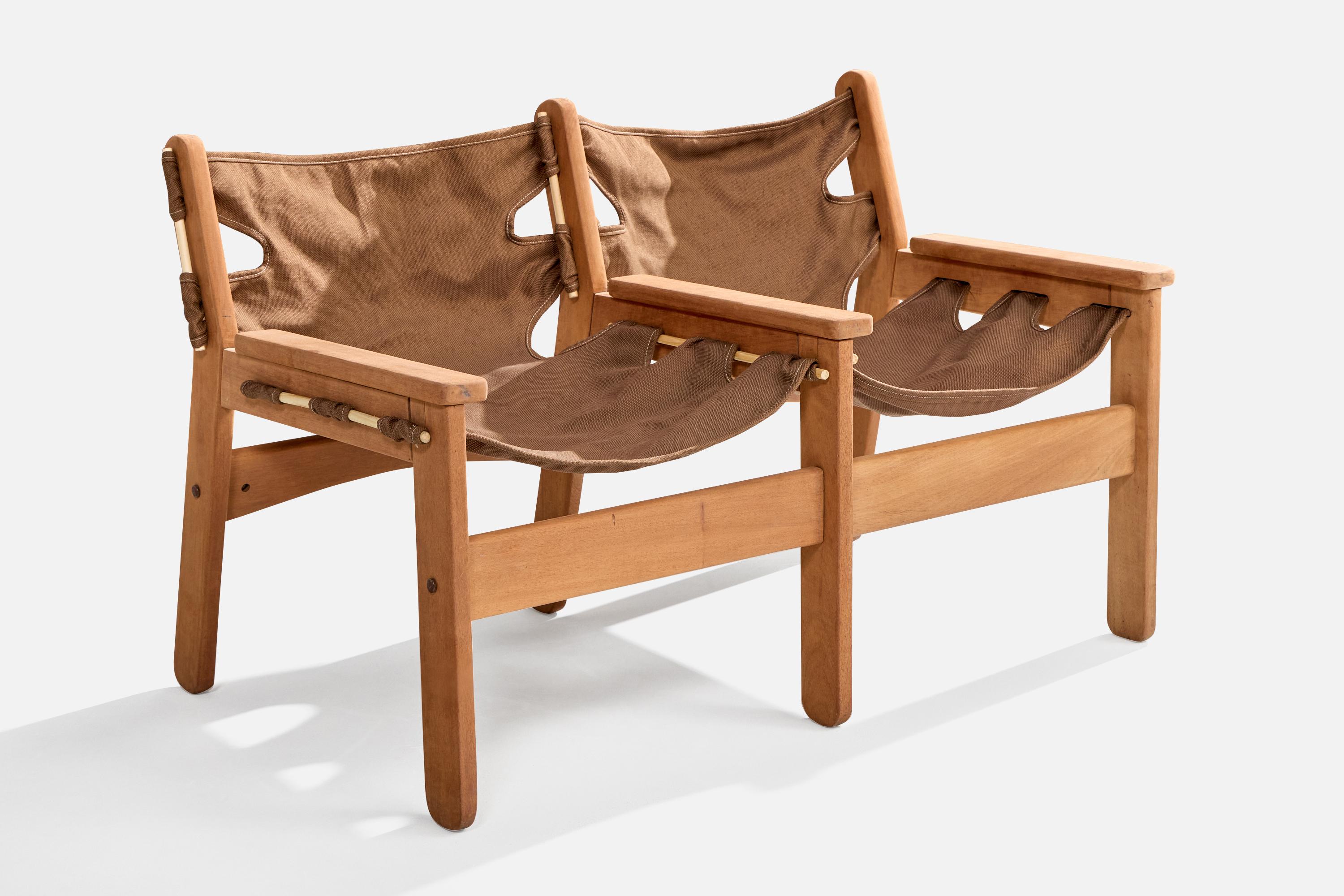 A wood and brown canvas bench designed and produced in Brazil, c. 1970s.

Fully refinished and brand new canvas seat replaced. Pre-restoration images available upon request.

Overall Dimensions (inches): 29.25” H x 47” W x 26” D

Seat Height
