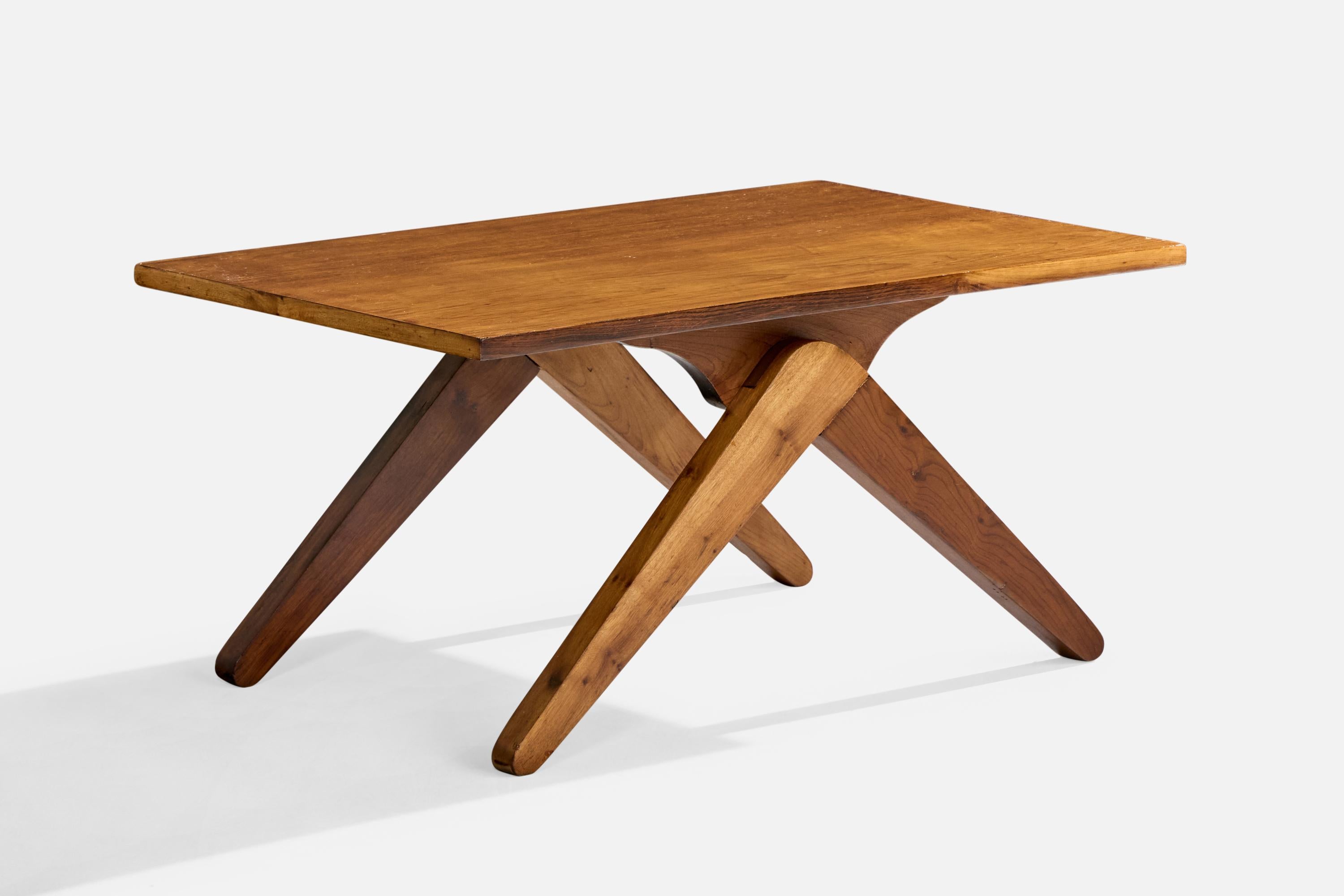 A wood coffee or side table designed and produced in Brazil, c. 1950s.

Dimensions: 15.275” H x 31.75” W x 19.9” D