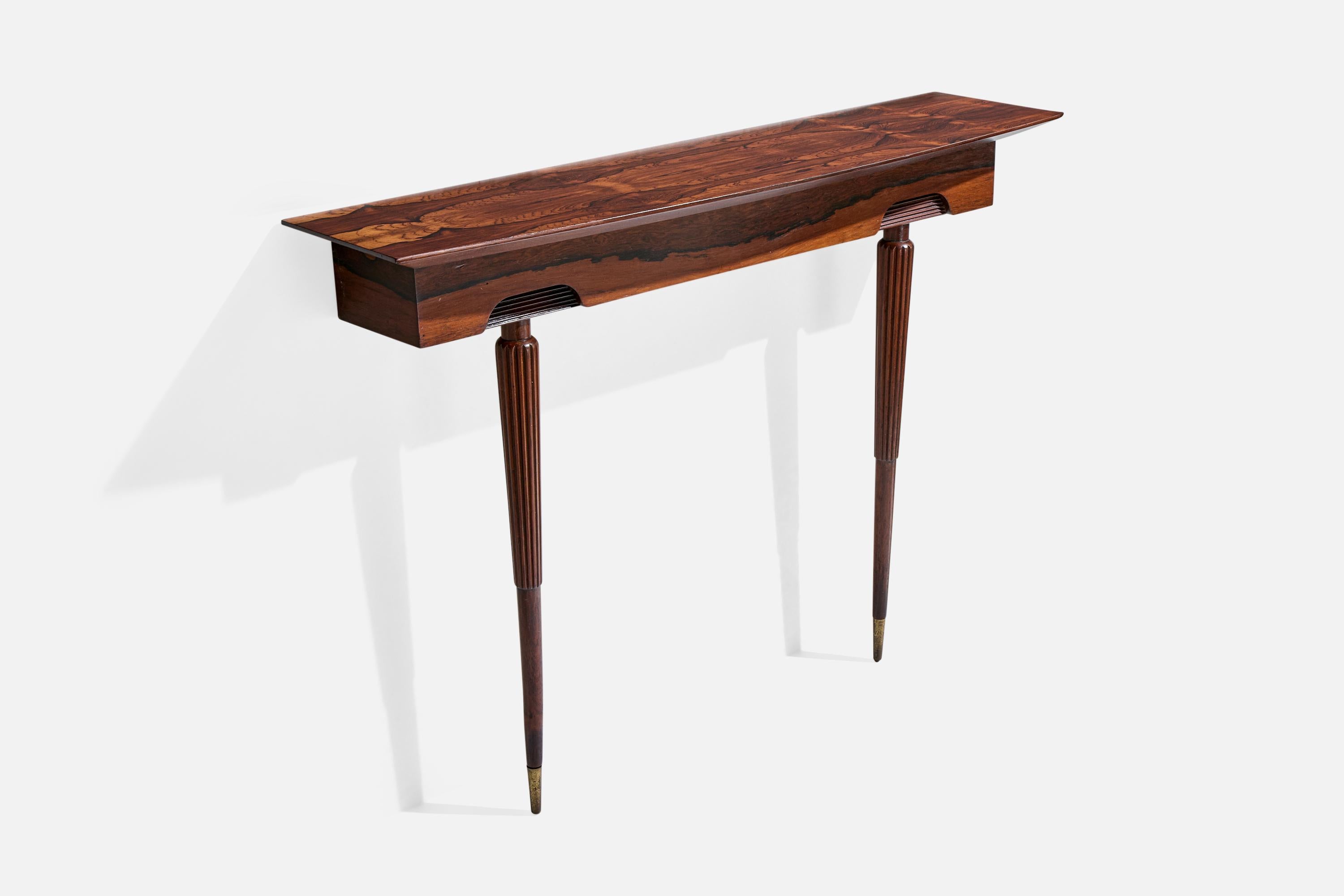 Consola de palisandro diseñada y fabricada en Brasil, c. 1950.

Dimensiones totales (pulgadas): 34,75
