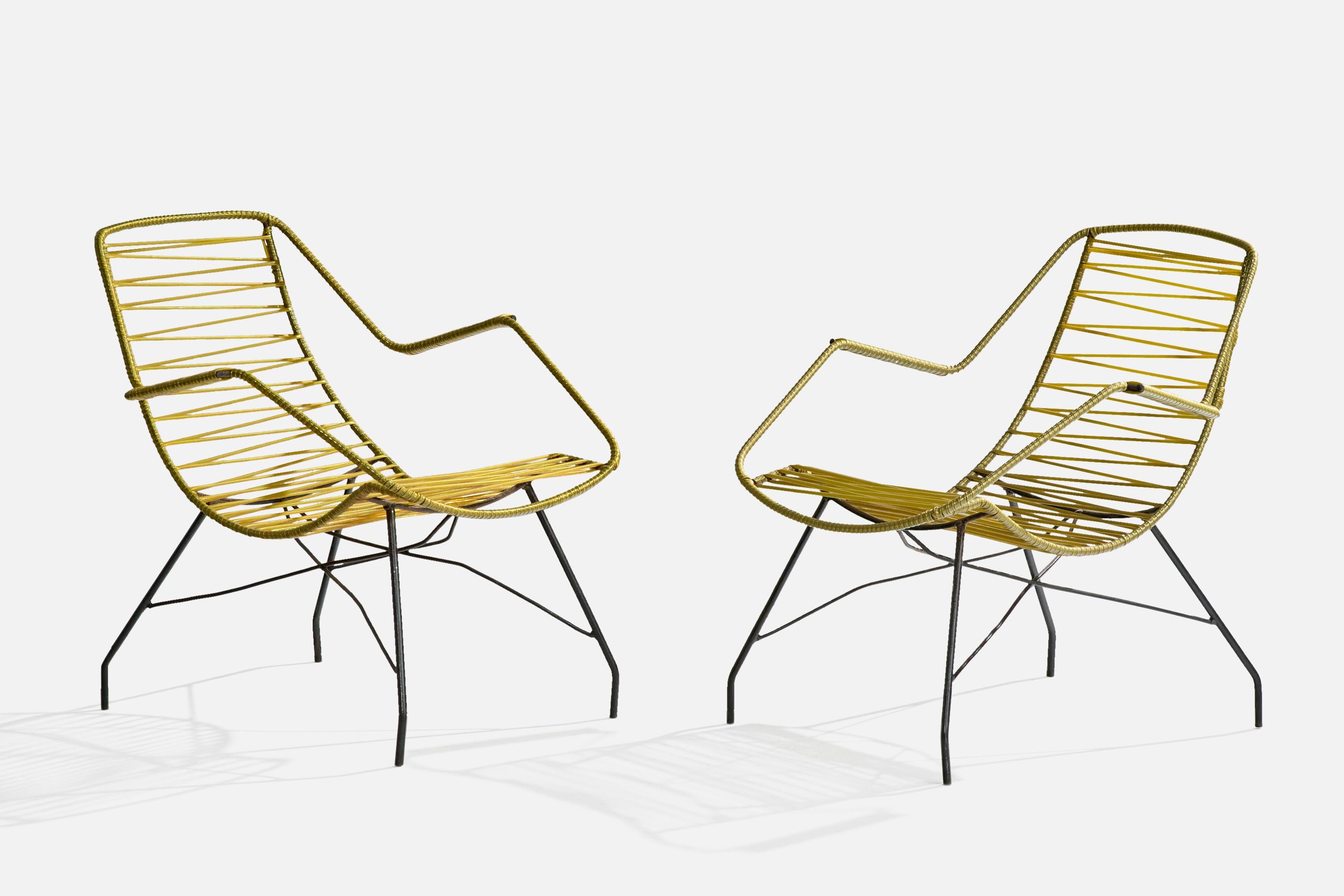 A pair of black-painted iron and yellow plastic band garden lounge chairs designed and produced in Brazil, c. 1960s.

Very light oxidation to iron legs.

Overall Dimensions (inches): 28.75” H x 23” W x 27” D

Seat Height (inches): 15” 

Arm Height
