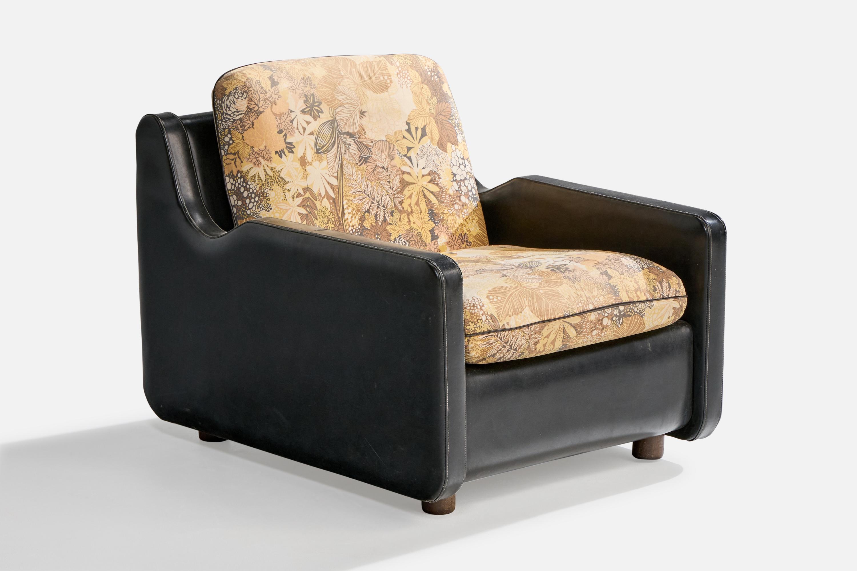 A black leatherette, floral-printed fabric and dark-stained wood lounge chair designed and produced in Brazil, c. 1960s.

Small 1.2” horizontal tear on left armrest (facing chair). Vintage leatherette and fabric in fair condition, ideally