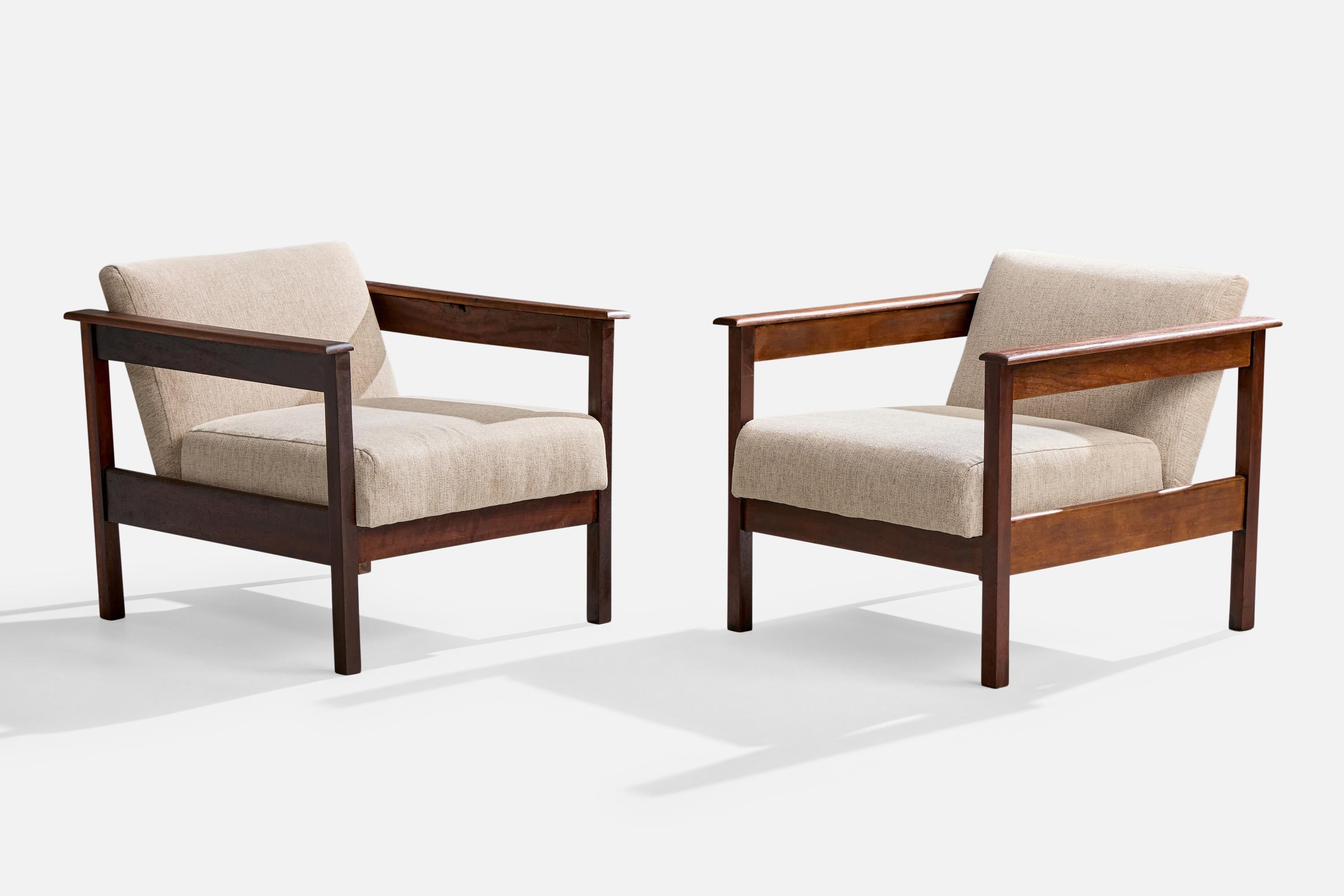 A pair of wood and off-white fabric lounge chairs designed and produced in Brazil, c. 1960s.

Overall Dimensions (inches): 24.5
