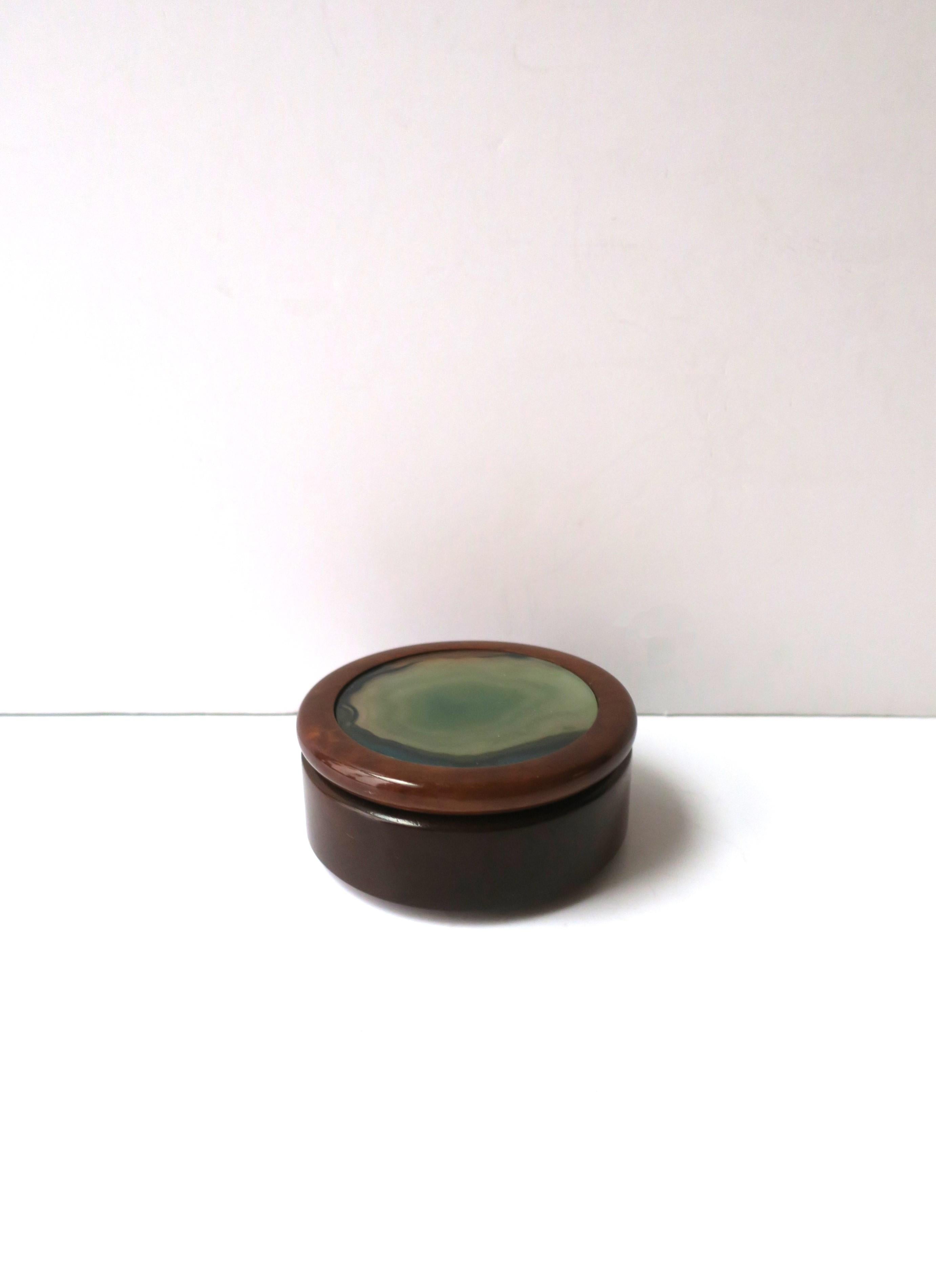 A Brazilian hardwood and agate onyx round jewelry or trinket box, in the Modern style or Post-Modern period, circa late-20th century, 1980s to early 1990s, Brazil. Box is a hardwood with a green agate onyx lid. Agate is a combination of greens -