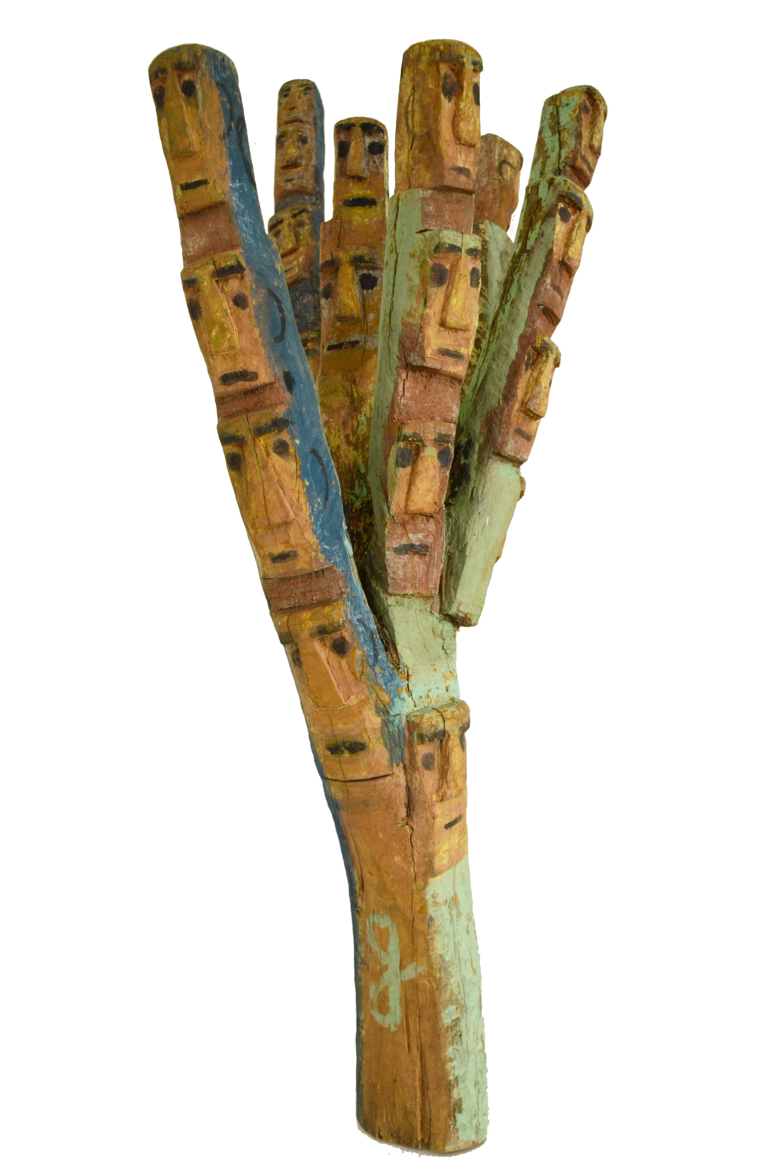 Caboeta's  hand-carved wood sculpture “Men” (originally entitled 
