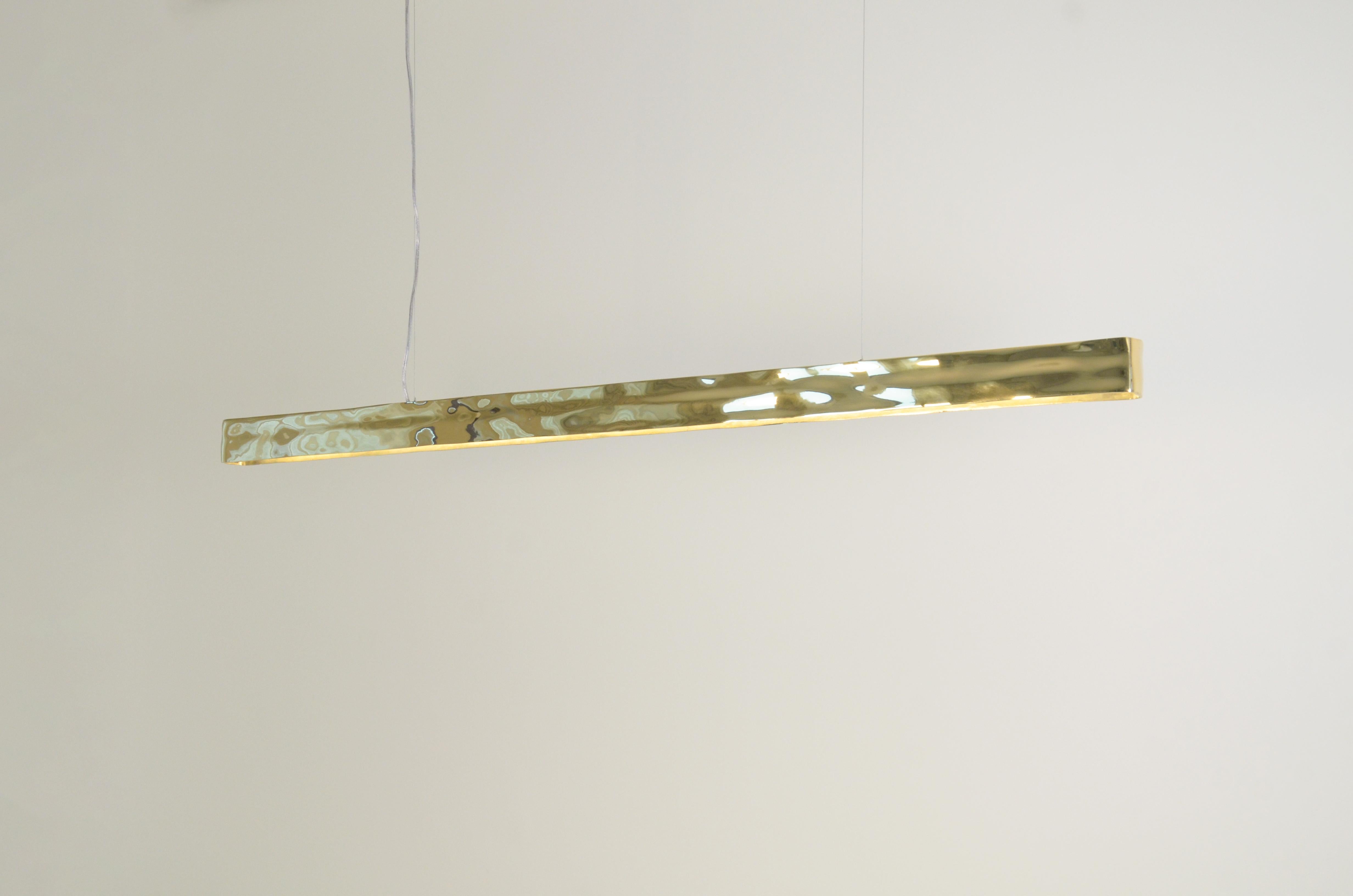 Ciondolo su ordinazione realizzato in bronzo fuso da uno stampo in argilla fatto a mano.

Lo stampo è stato creato dal designer Cris Bertolucci con l'aiuto di uno scultore specializzato nella lavorazione dell'argilla.

Il pezzo è stato pre-lanciato