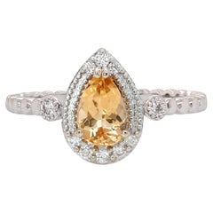 Bague en or blanc massif 14K avec topaze brésilienne et halo en diamant naturel
