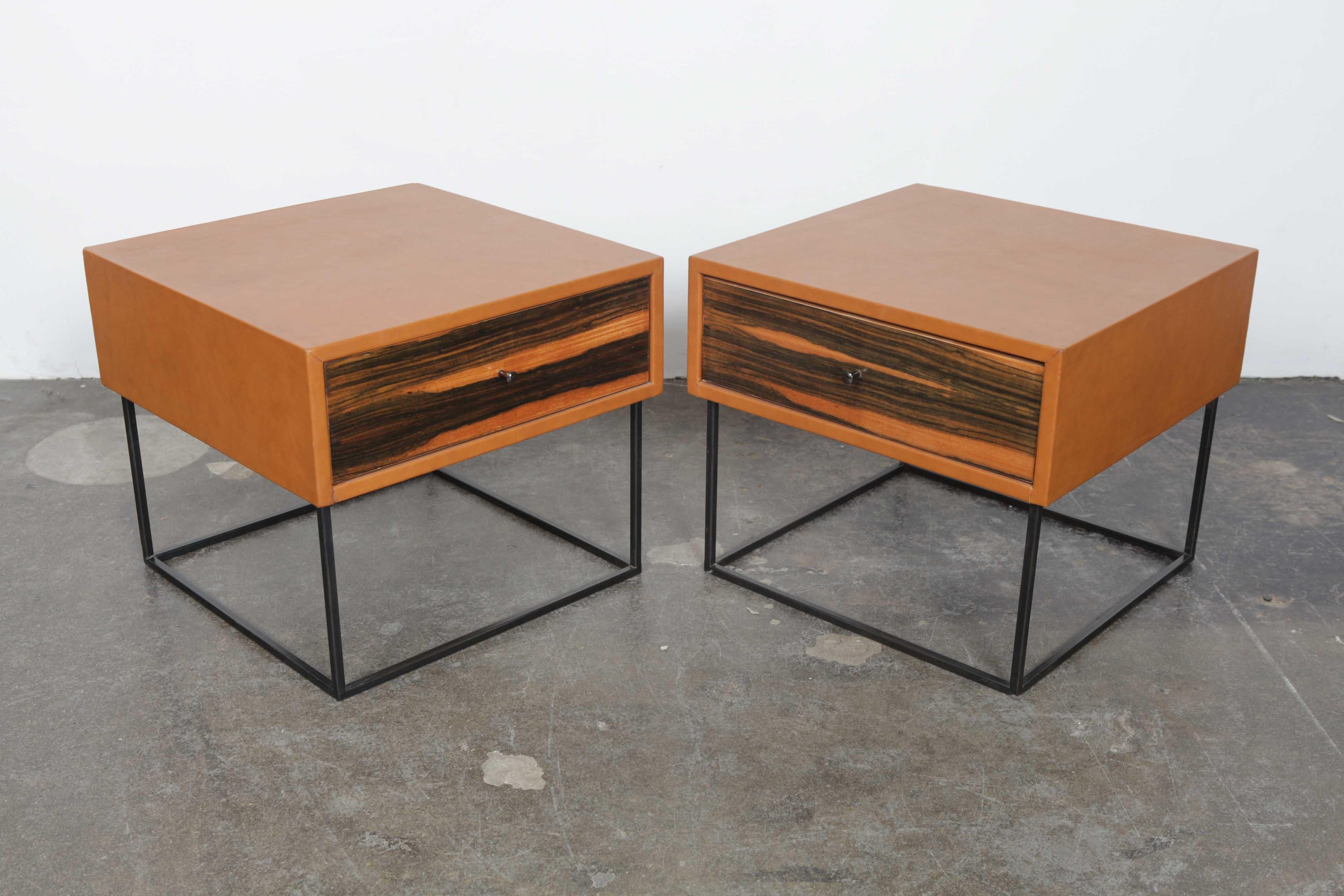Pair of leather wrapped single drawer end tables which combine vintage 1960s Brazilian drawer fronts with newly made cube metal bases and newly leather wrapped drawer boxes.