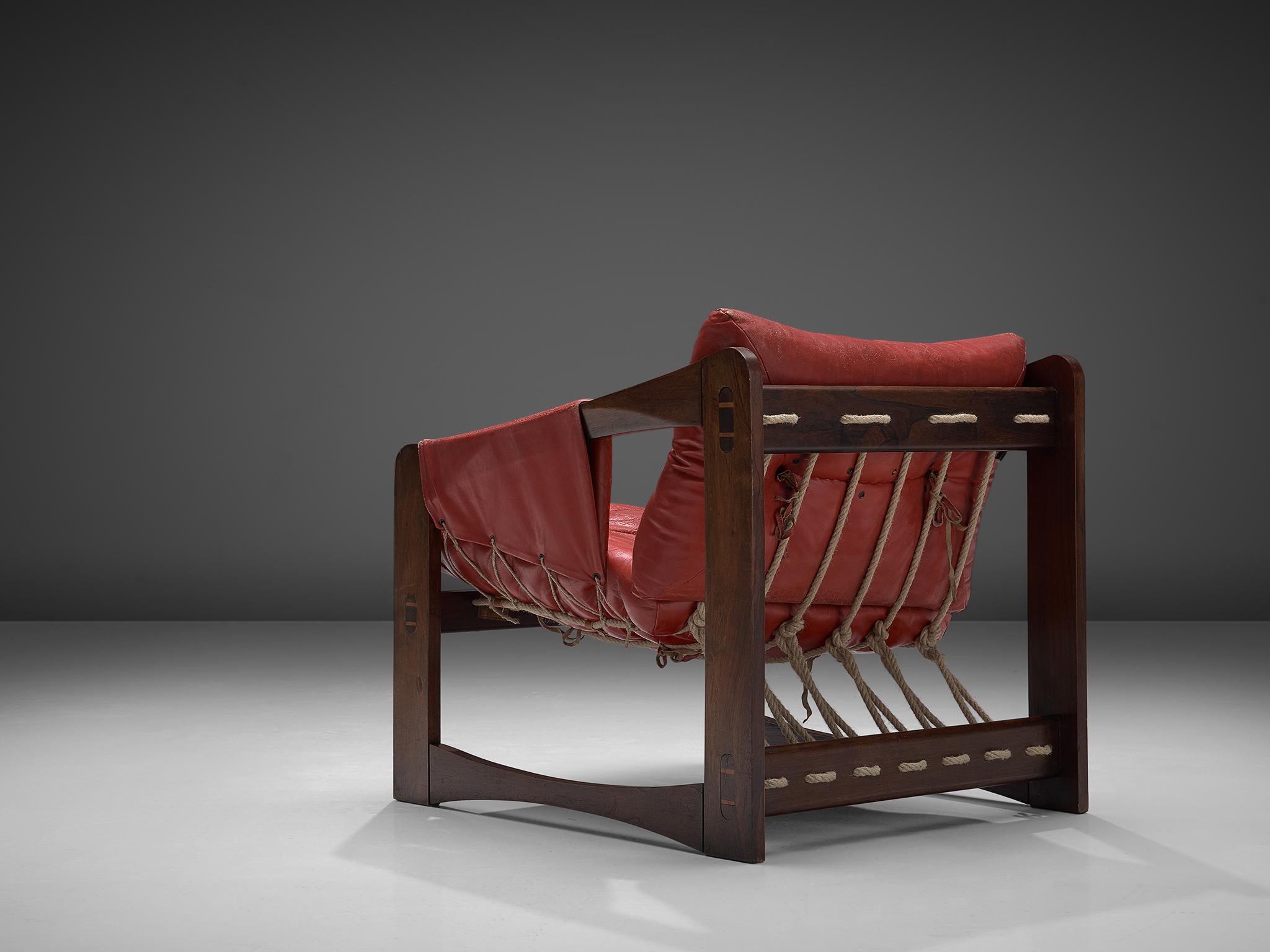 Liceu de Artes e Oficios Sao Paulo, lounge chair, in leather and wood, Brazil, 1960s.

Exquisite comfortable lounge chair made of solid dark stained wooden construction accompanied with nice contrasting ropes. Besides the aesthetic addition of the