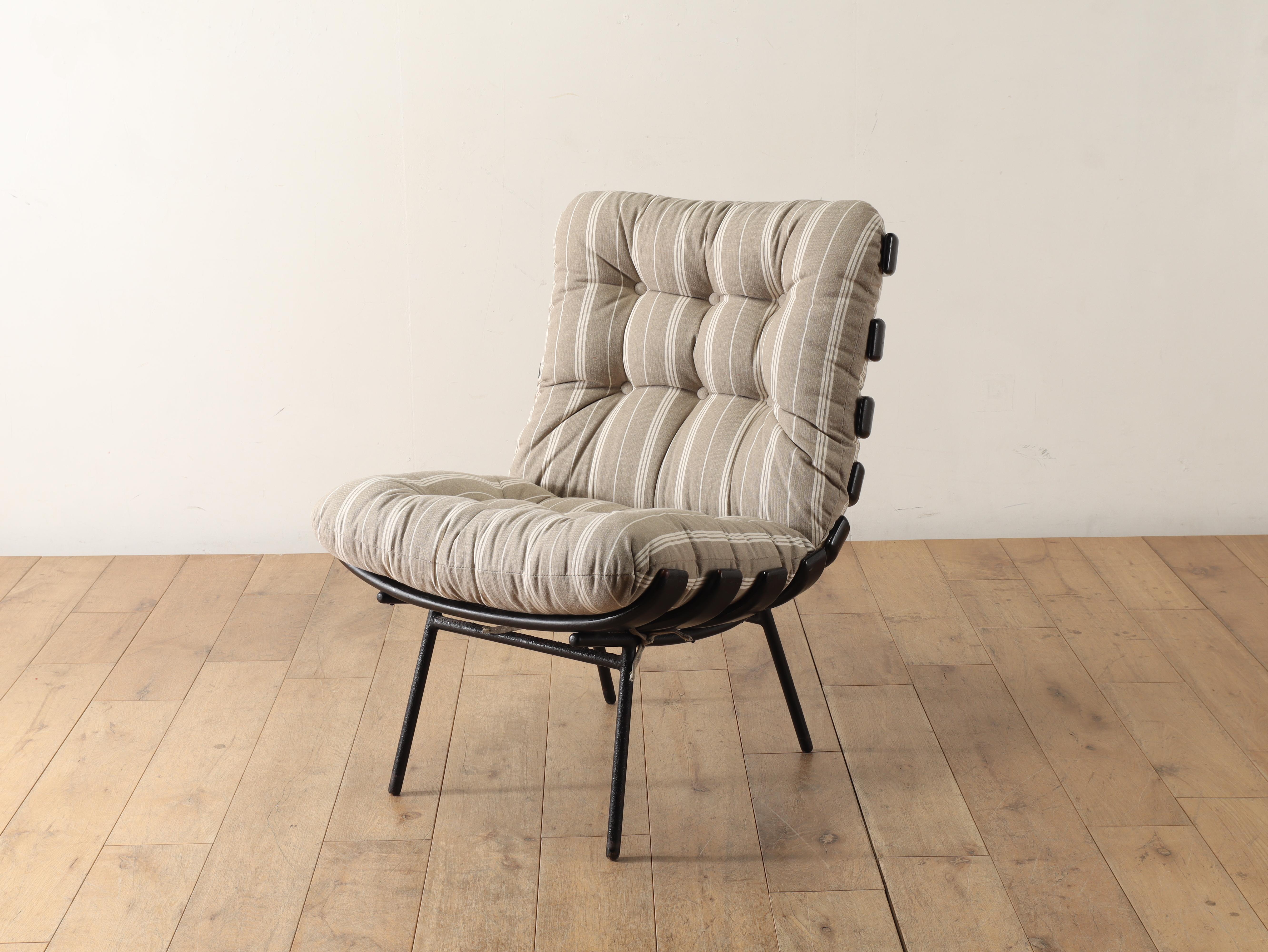 1950s (estimated) Brazilian vintage lounge chair. Native Brazilian wood, invuia, also known as Brazilian walnut, has a great appeal due to its deep texture. The details created by moulding such wood in a unique form reproduce a style not found in