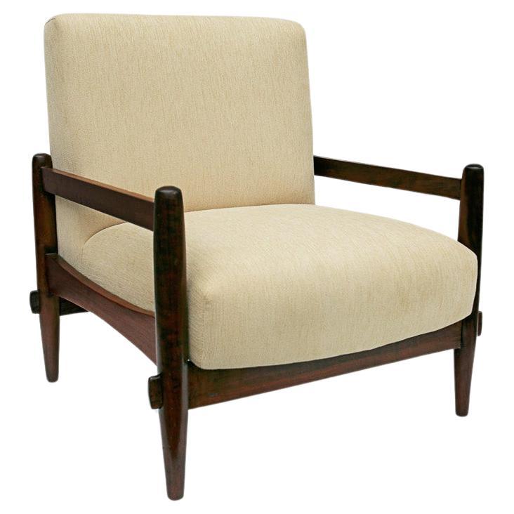 Available today, with domestic shipping in the NYC metro area included, this Brazilian Mid-Century Armchair in Wood and Leather by Michel Arnoult, c. 1960s, is nothing less than gorgeous! Crafted in the 1960s, this beautiful armchair features a