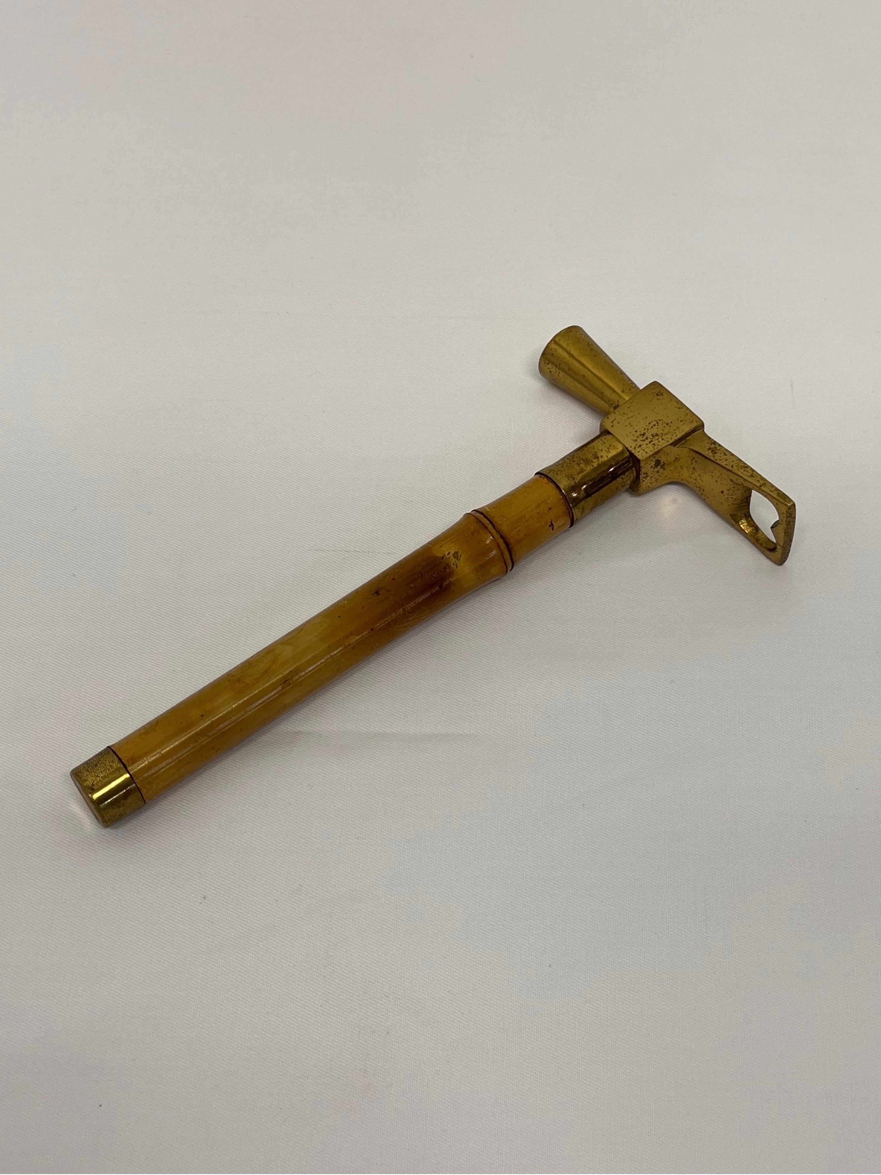 Brazilian modern bottle opener and ice hammer with hidden corkscrew for wine attached to a bamboo handle, 1950s.