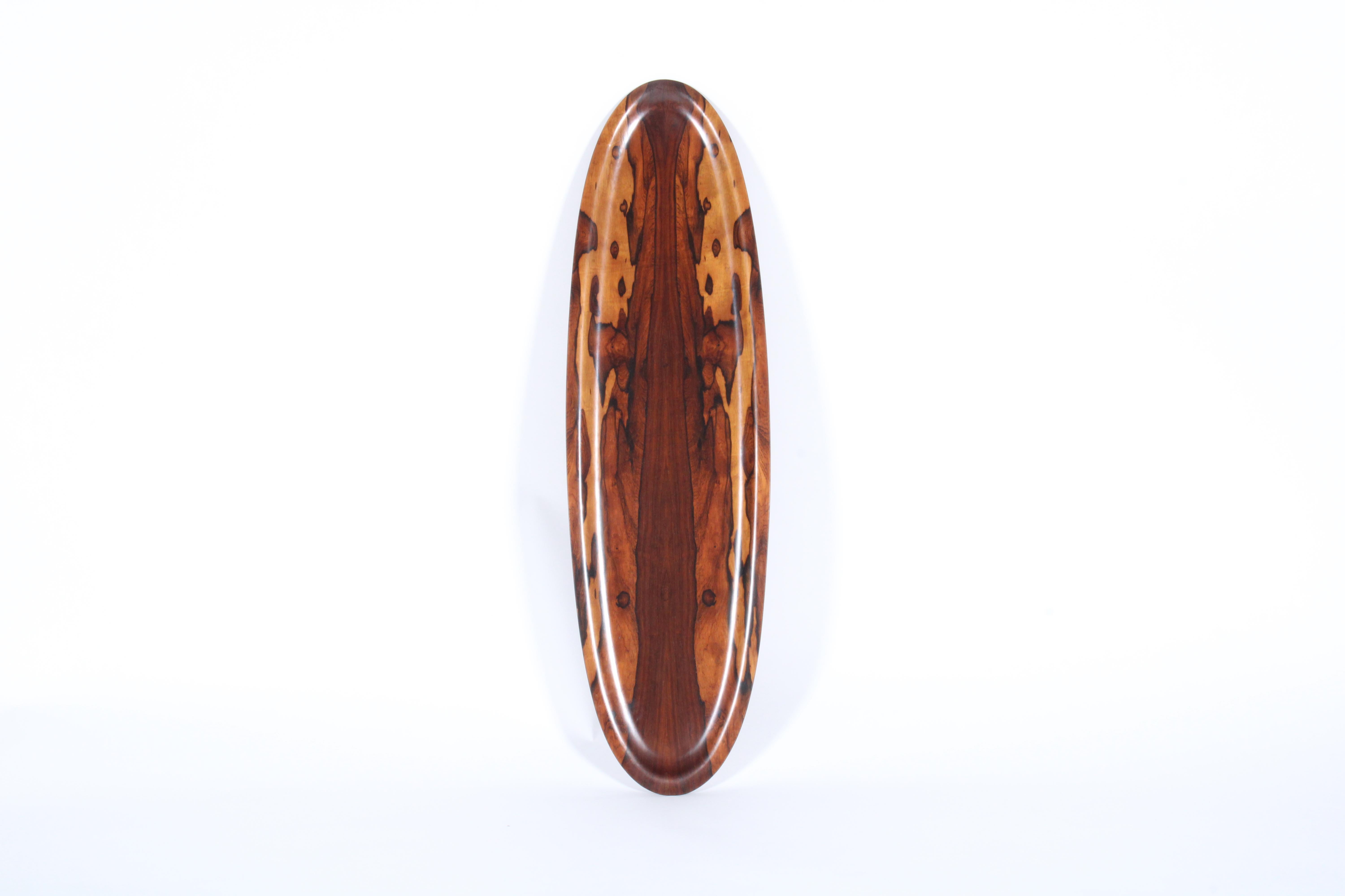 A truly rare find this incredibly beautiful canoe bowl centerpiece is crafted from the most amazing jacaranda wood, a rare timber with sensational grain pattern which was typically used in high end mid century pieces by celebrated Brazilian