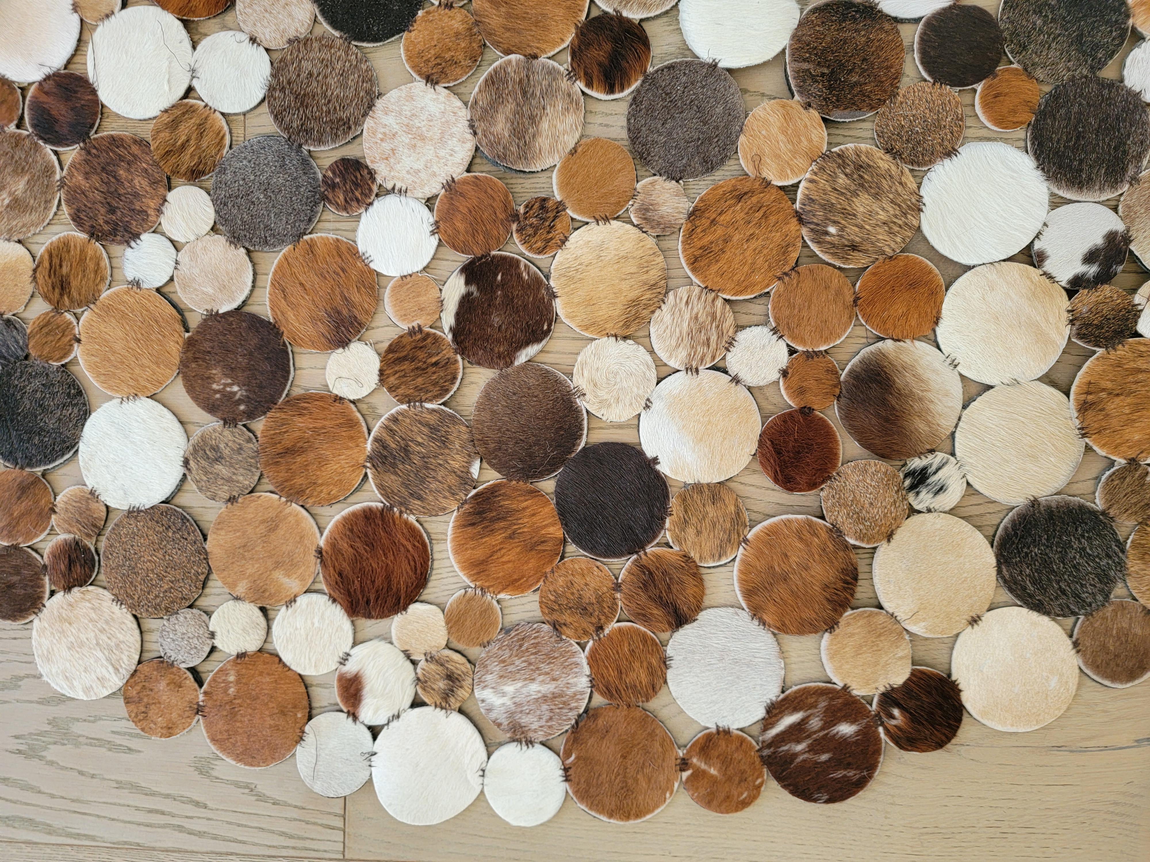 Midcentury Brazilian Leather rug. Circular patches make this rug. The different browns in the rug make a wonderous design. Each circular patch is identical in size.