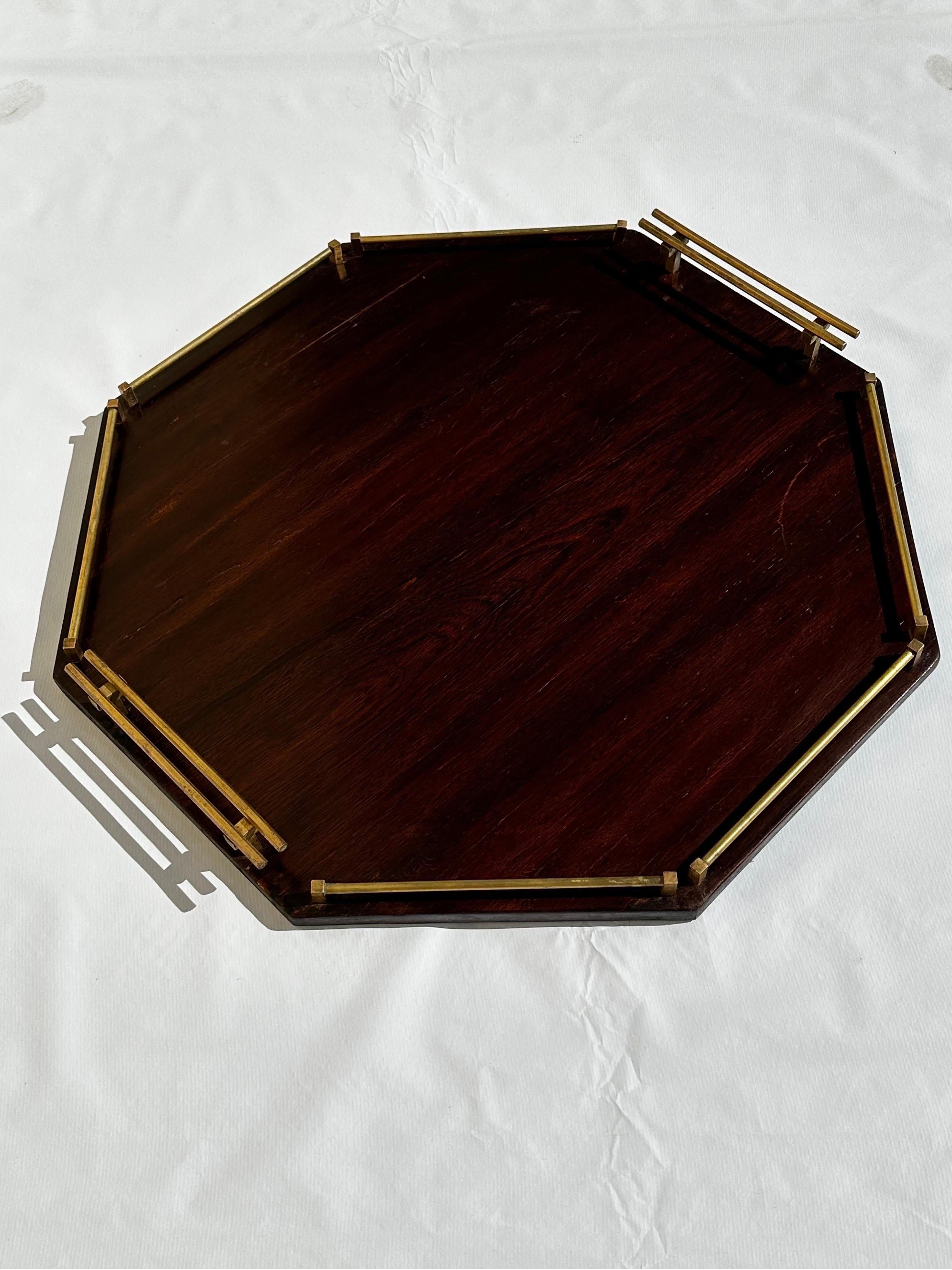 Brazilian Jacaranda Rosewood serving tray with brass handles and brass side stoppers from the 1960s. Although the designer is unknown, it resembles designs from the likes of Sergio Rodrigues, Jorge Zalszupin and Celina Decorações.