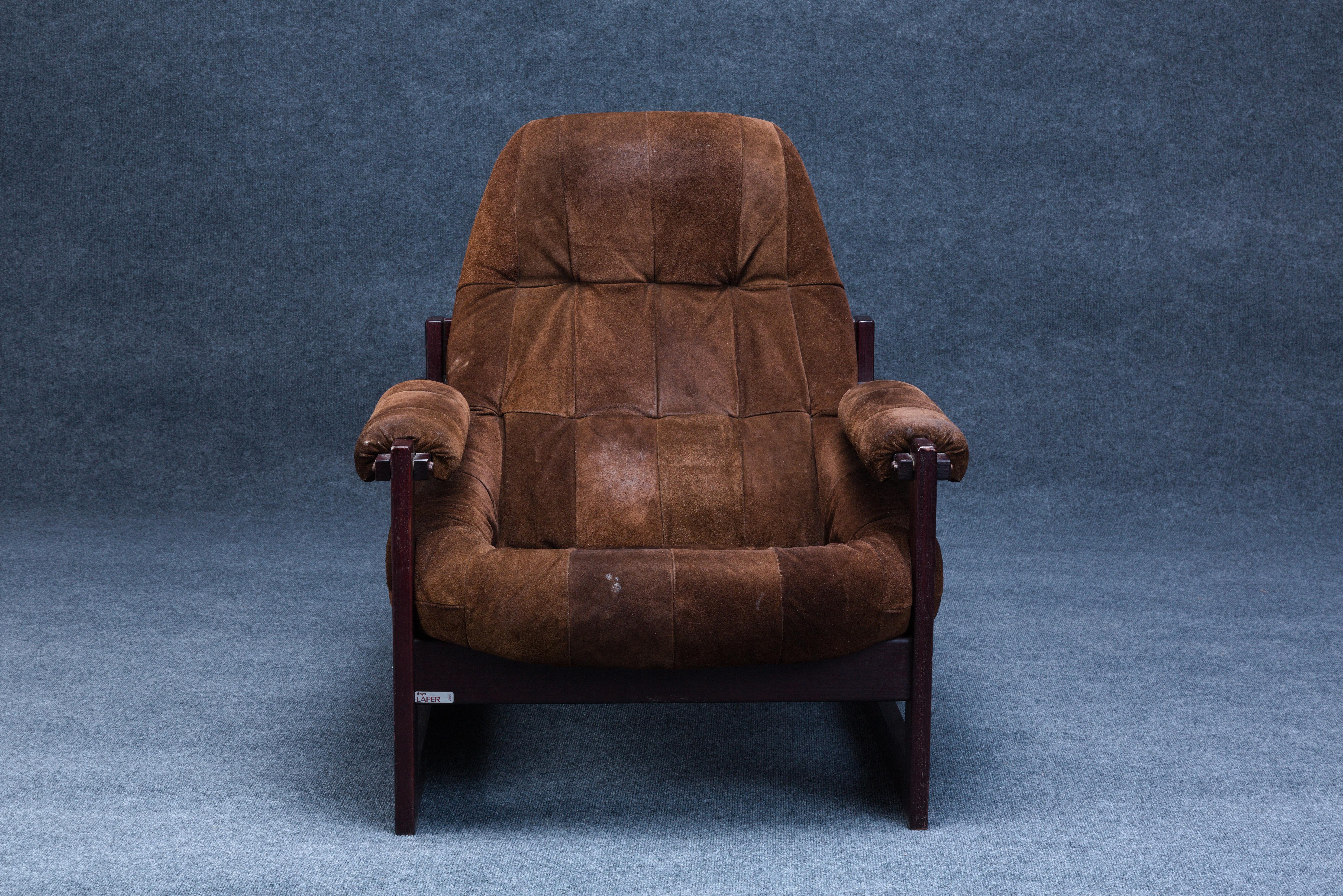Percival Lafer (Brazilian, b. 1936) Lounge Chair and Ottoman, Brazil, c. 1965, rosewood frames with leather upholstery, chair, foil Design Lafer label and remains to a paper label, ht. 36, seat ht. 15 1/2, wd. 32, dp. 32, ottoman conforming with