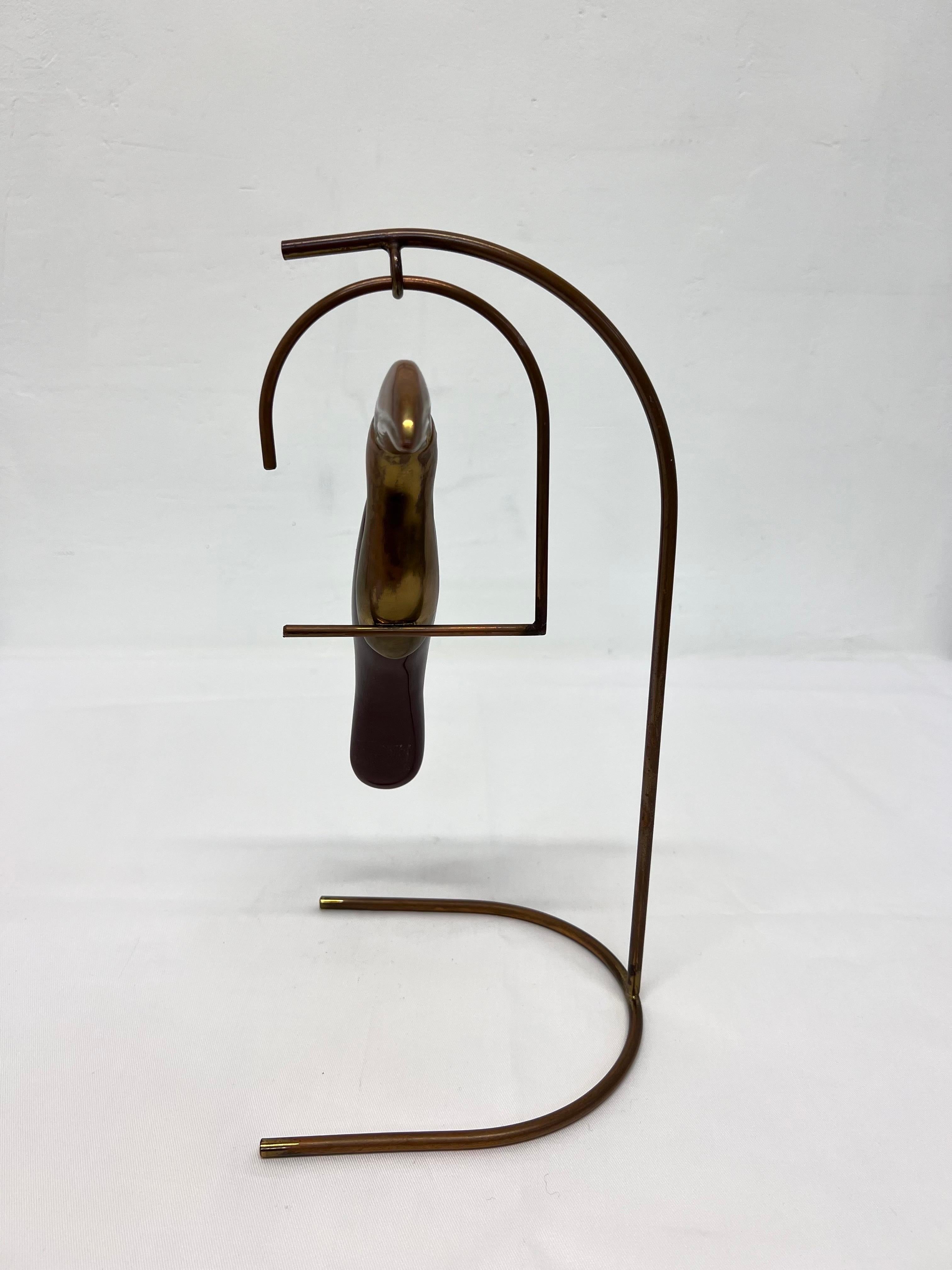Patinated brass Toucan sculpture with dark maroon colored resin body suspended from brass metal stand, Brazil 1960s.