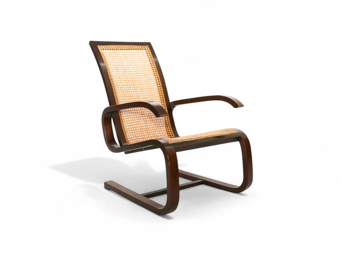 Vannerie Fauteuil à bascule brésilien du milieu du siècle en bois dur et cannage, Unknown, c. 1960's en vente