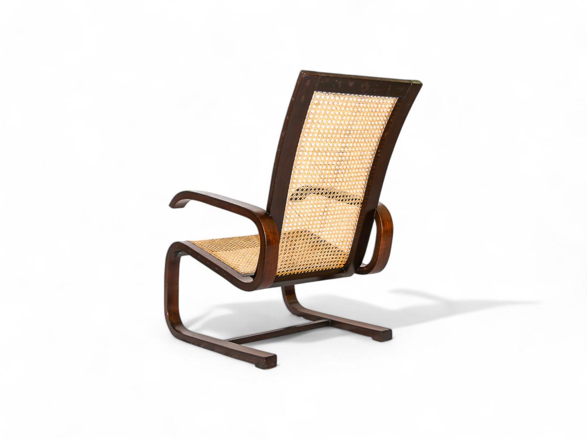 Canne Fauteuil à bascule brésilien du milieu du siècle en bois dur et cannage, Unknown, c. 1960's en vente