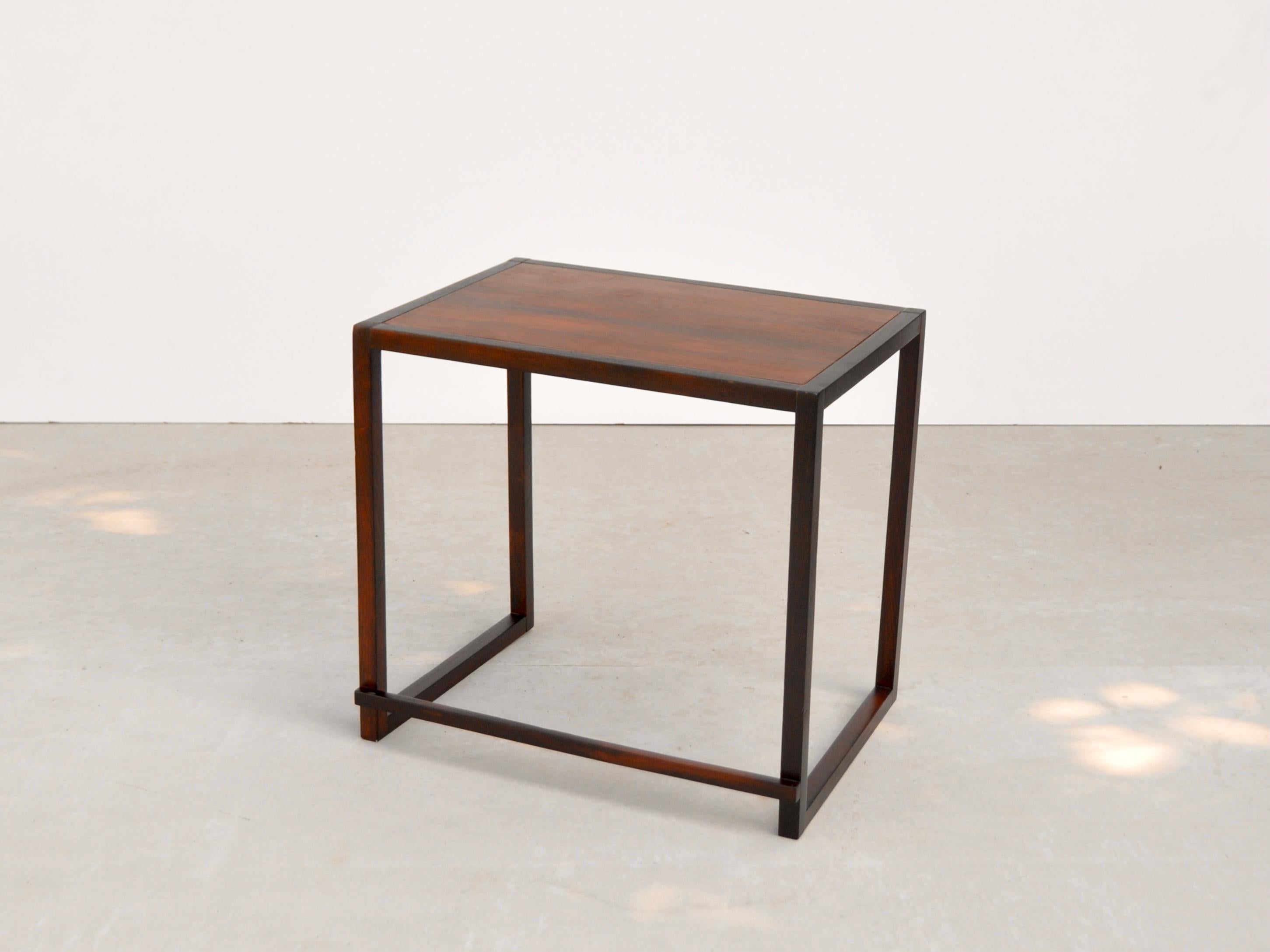 Side table with solid rosewood structure and laminated rosewood top by unknown author.