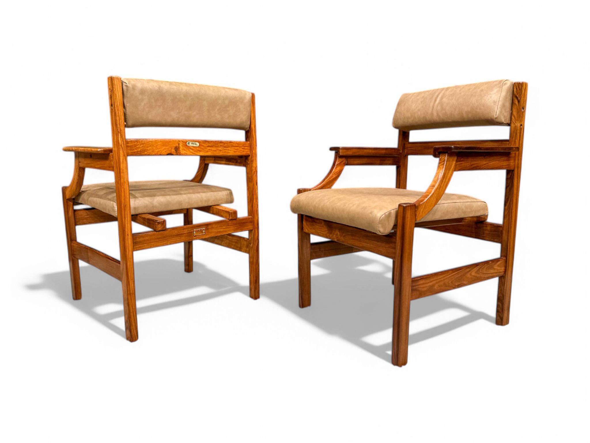 Available immediately, these Mid-Century Modern Armchairs in Hardwood & Faux Leather, are stunning!

The armchair structure has straight lines and is made entirely of Caviuna wood, a favorite one for designers like Giuseppe Scapinelli and Rino