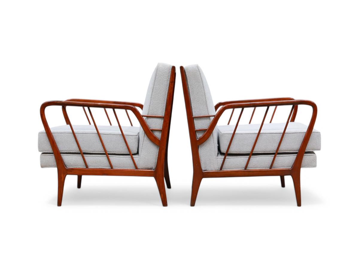 Available today, this stunning pair of armchairs embodies the essence of Brazilian mid-century design, showcasing captivating beauty through exquisite wood craftsmanship and organic shapes. The armrests, featuring tilted architectural lines, add a
