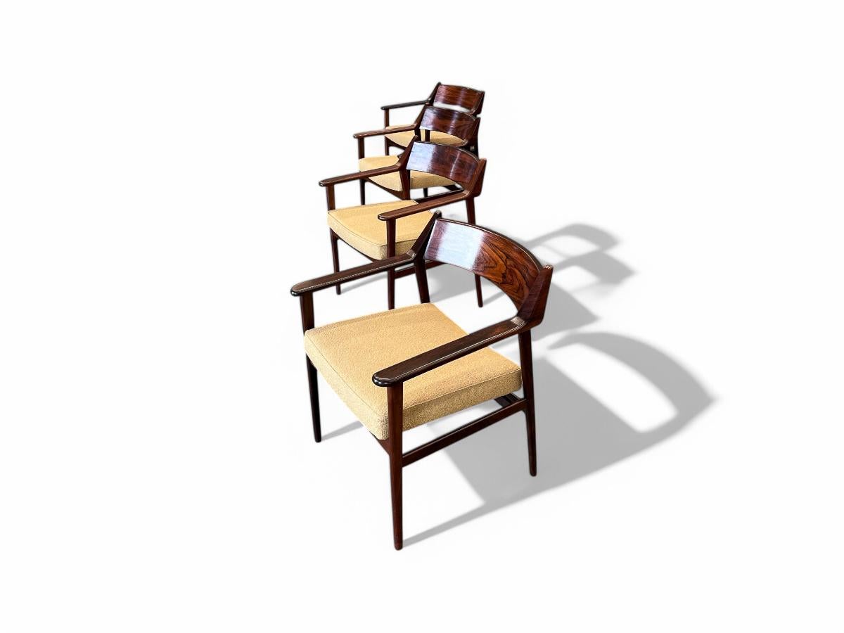 Available today, these beautiful chairs with armrests were designed by Jorge Jabour for Cantù Móveis e Interiores Ltda. in the 1960s. Each chair features a structure entirely made in Brazilian rosewood, known as Jacaranda and has a cushion in a