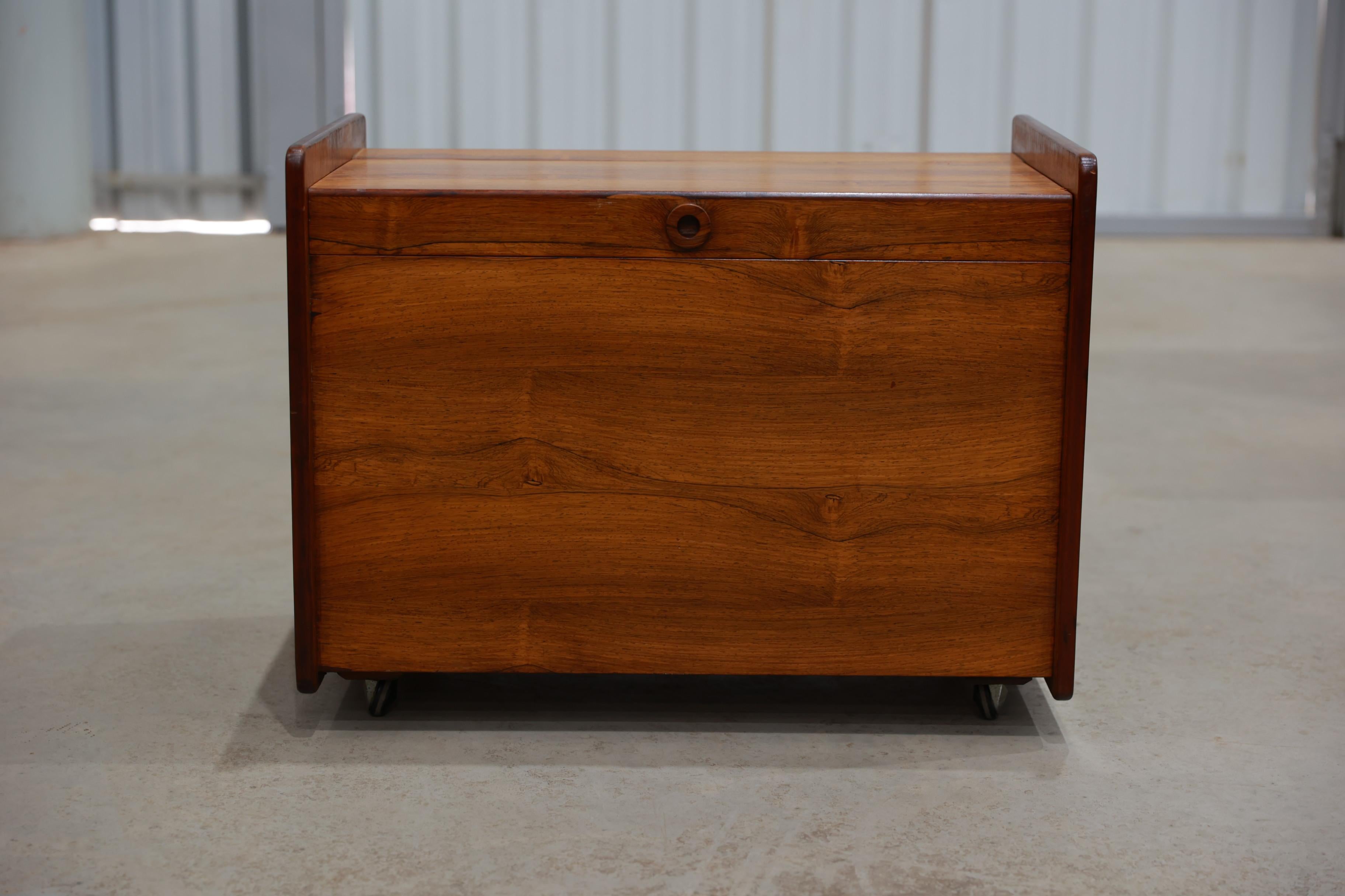 Available today, this midcentury bar cart made in solid hardwood is stunning! The bar cart is composed of one big door, two shelves with a bottle holder and four (original) wheels that work perfectly.

The bar cart has a beautiful design bringing