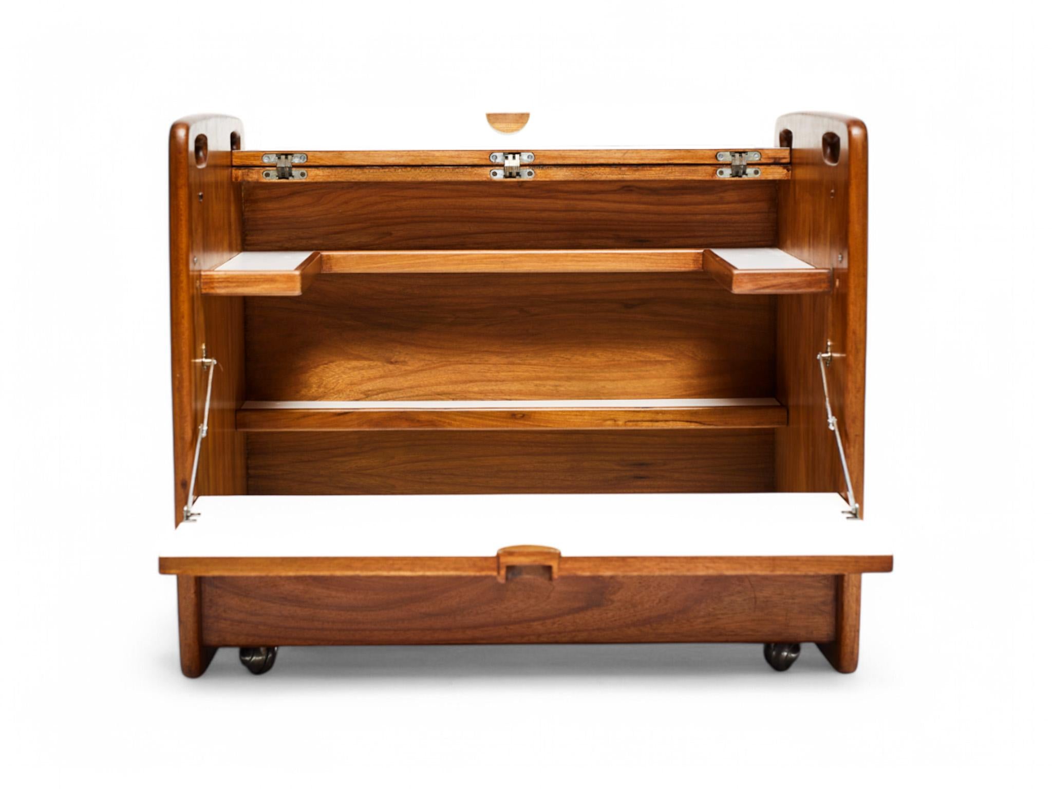 Available today, this midcentury bar cart made in solid hardwood is stunning! The bar cart is composed of two doors for storage, two shelves with a bottle holder and four (original) wheels that work perfectly.

The bar cart has a beautiful design