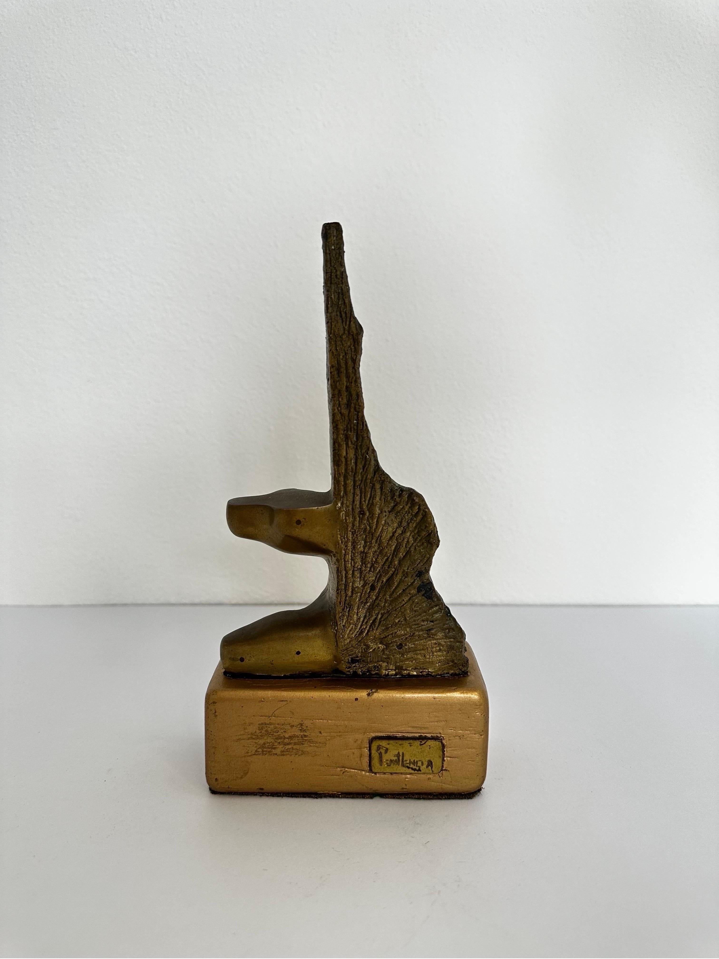 Sculpted by Brazilian plastics artist Penithencia, this unique brutalist abstract bronze sculpture sits a top a bronze painted wood base.  Signed and numbered 2/9 on bronze and maintains plaque on base.