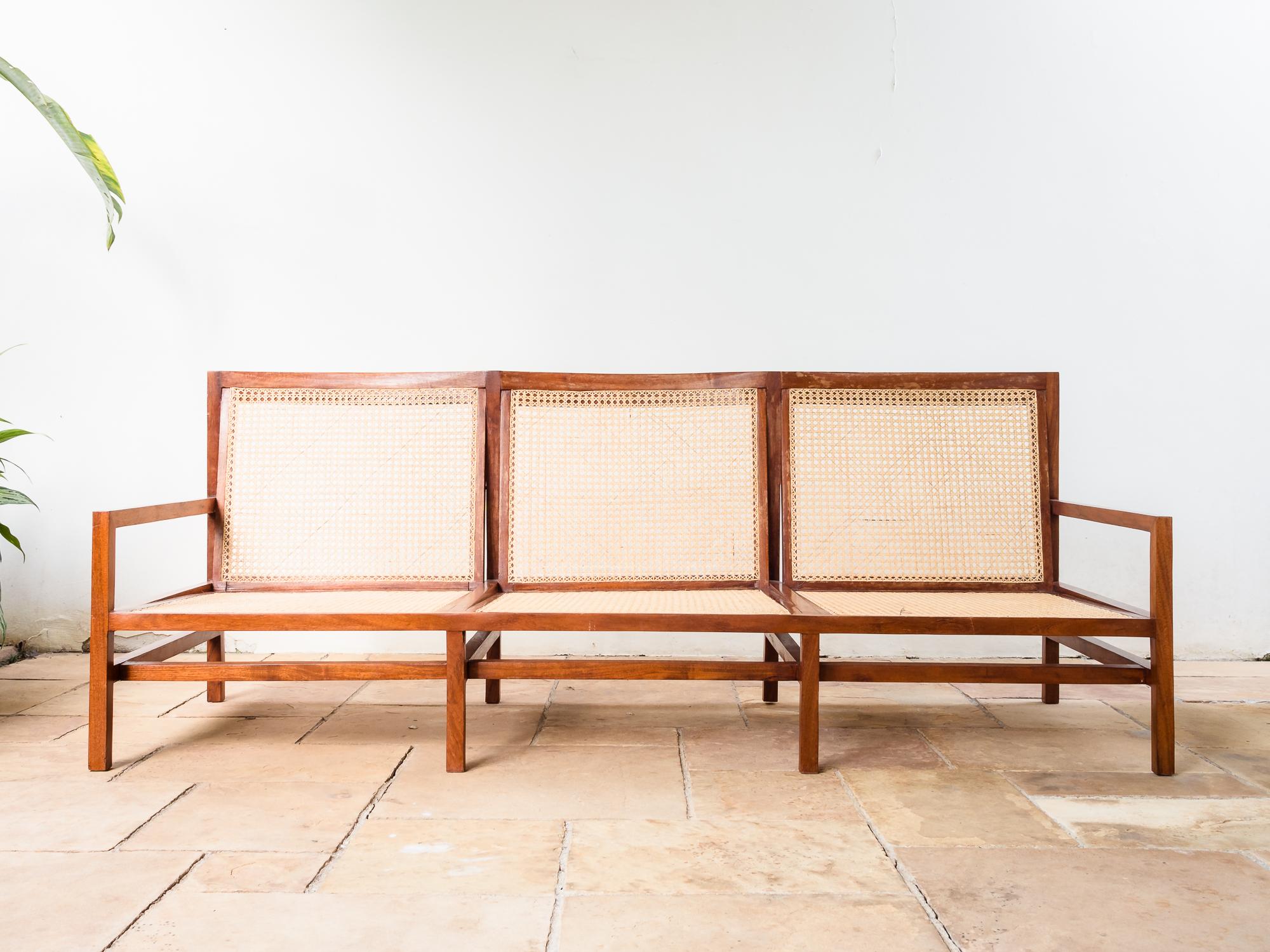 Brazilian Mid-Century Modern Cane and Peroba Branca Hardwood Three Seat Sofa designed and produced by Joaquim Tenreiro, early 1960s.
This three seat sofa is amongst the most minimal and well executed by Joaquim Tenreiro, with extremely subtle