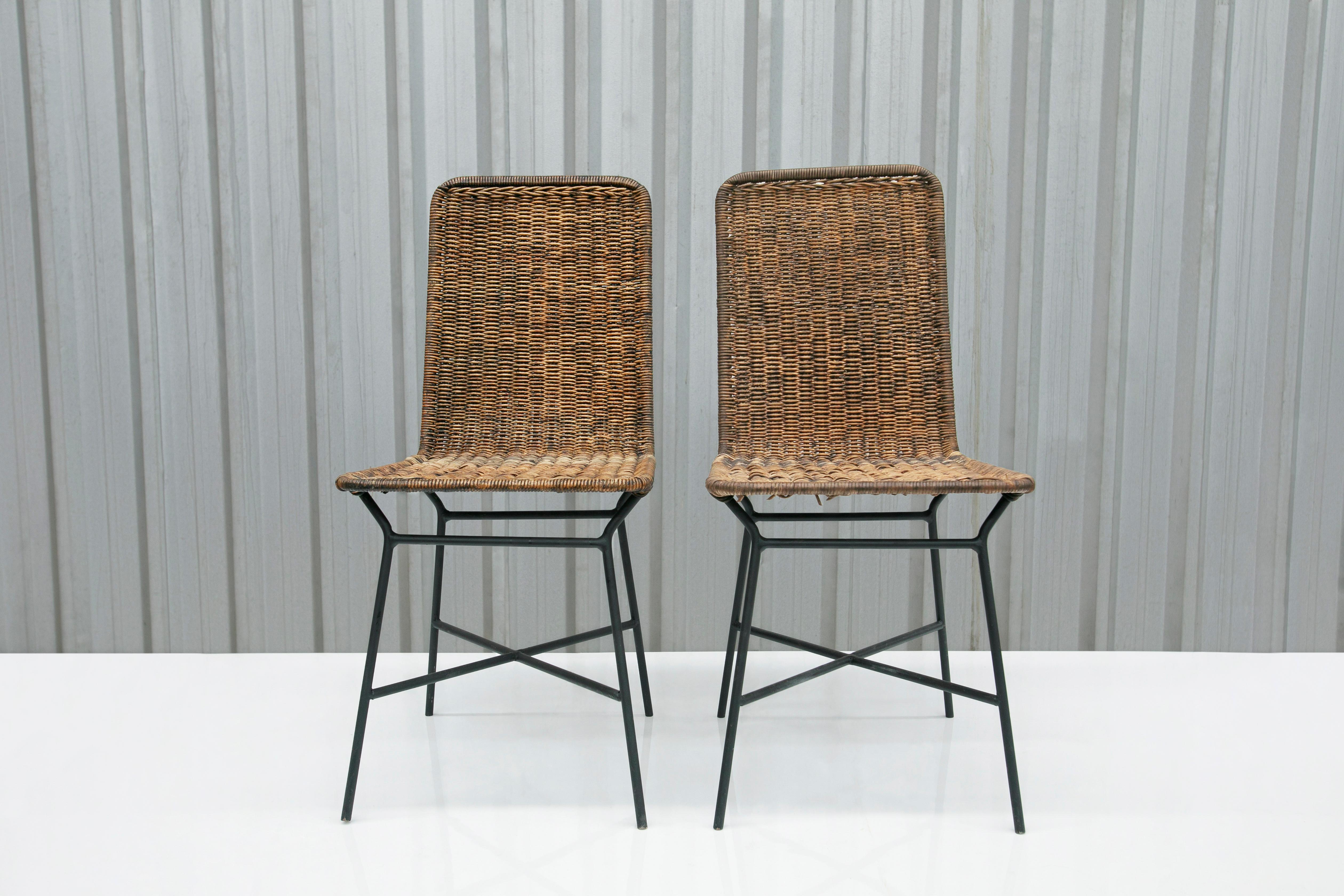Available today, these Mid-Century Modern chairs in Caning and Metal designed by Carlo Hauner in the fifties are beautiful!!

The chairs feature an iron structure painted in black covered in caning. Attached an image showcasing one chair with a
