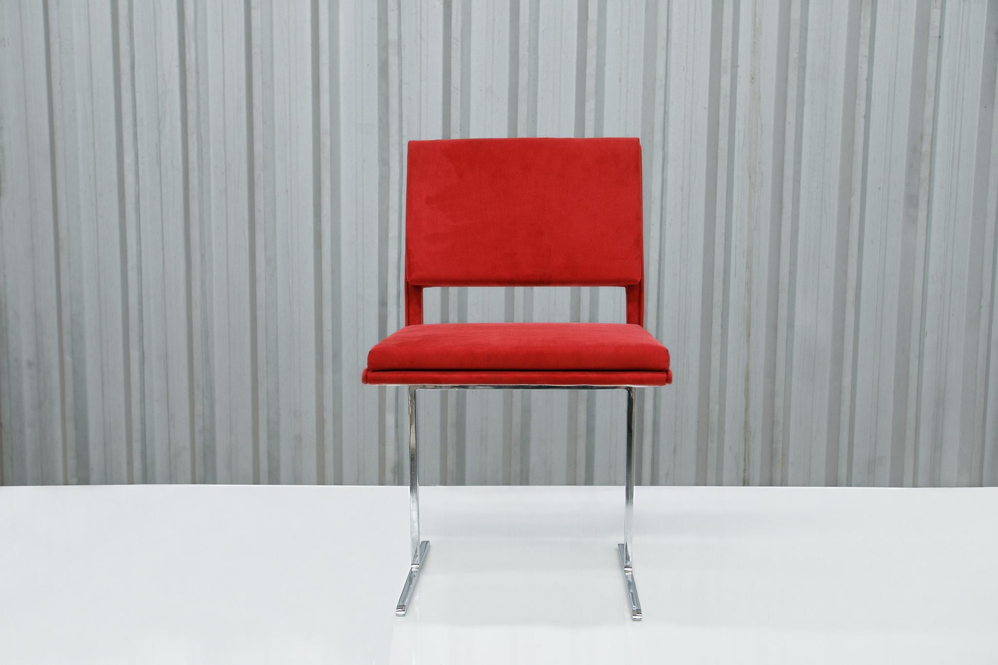 Available today, this Mid-Century Modern Chairs in Chrome & Red Velvet by Jorge Zalszupin, 1965 Brazil are a showstopper!
 
These gorgeous chairs feature a super sleek design composed of two chrome legs and a curved body structure consisting of a