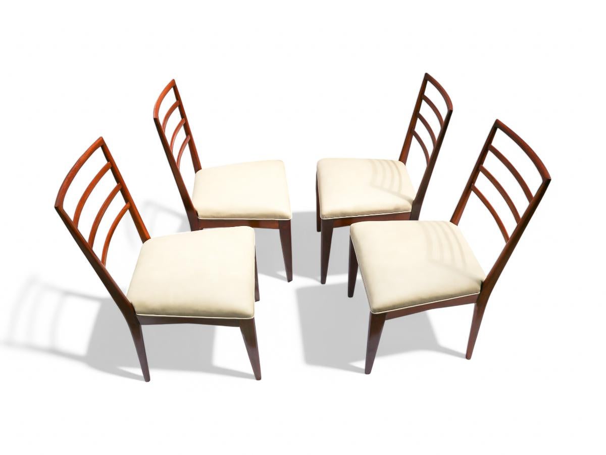 Available today, with domestic shipping in NYC metro area included.  This set of Mid Century Modern is nothing less than spectacular.  

This set of four Brazilian modern chairs, designed by Rino Levi, is made with a light brown caviuna hardwood,