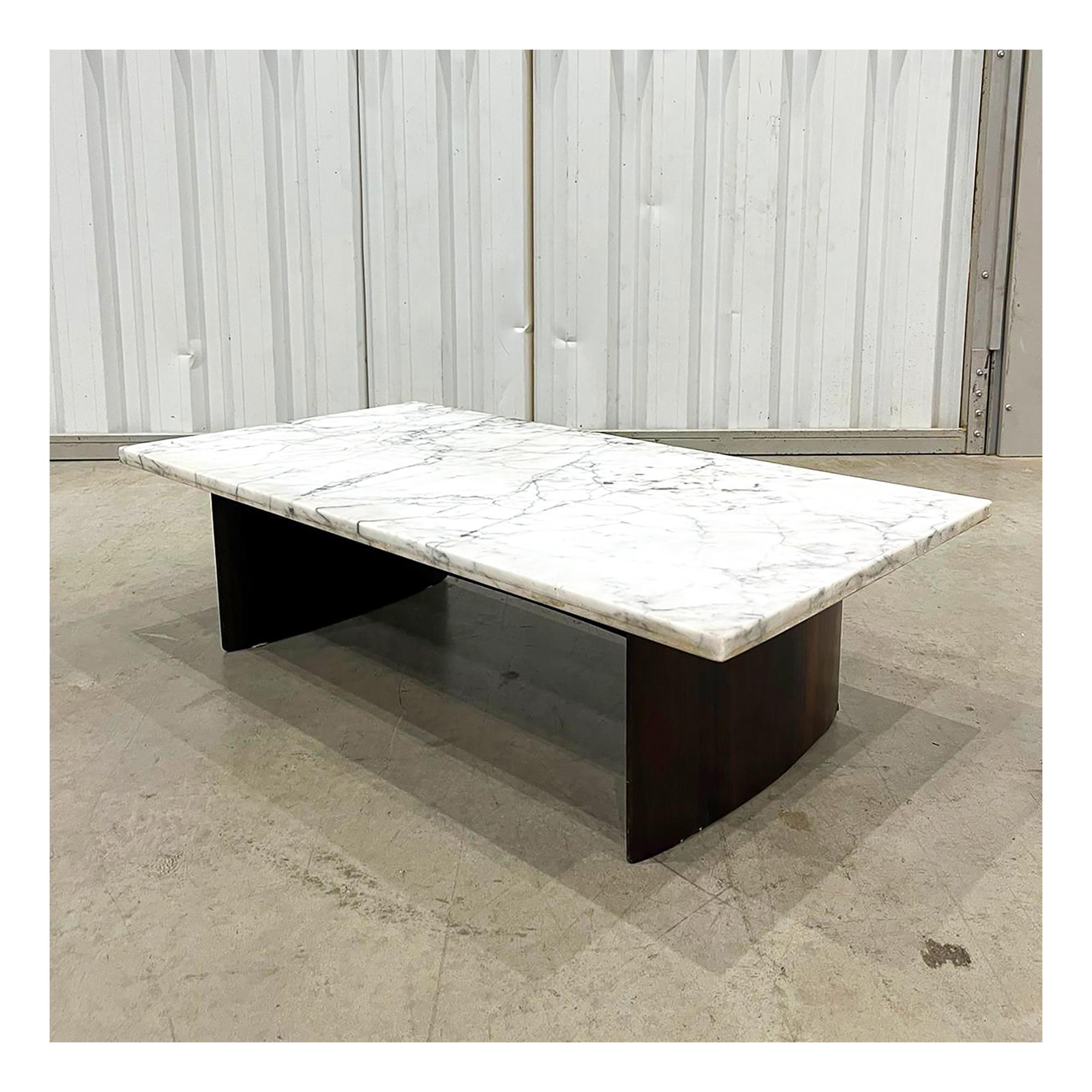 Available today in NYC with free domestic shipping included, this Brazilian Modern Coffee Table made in Hardwood and Marble by Joaquim Tenreiro in the 50's is gorgeous.

This coffee table has a wood structure made in Brazilian Rosewood, known as