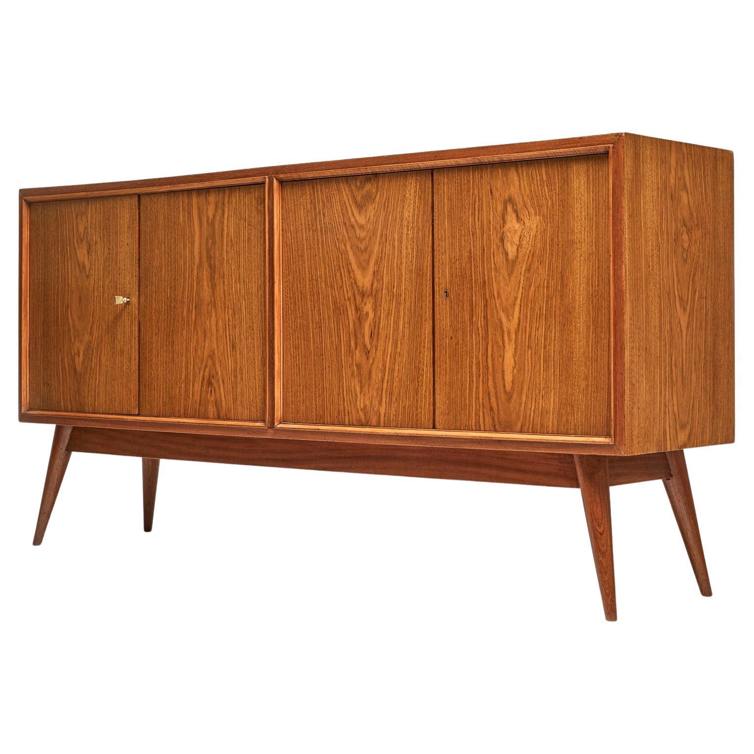 Available now, this Brazilian Modern credenza, attributed to Joaquim Tenreiro in 1942 during his last year at Laubisch & Hirth, a high-end furniture firm in Rio de Janeiro, before starting his own new chapter as a Modernist designer. This piece is