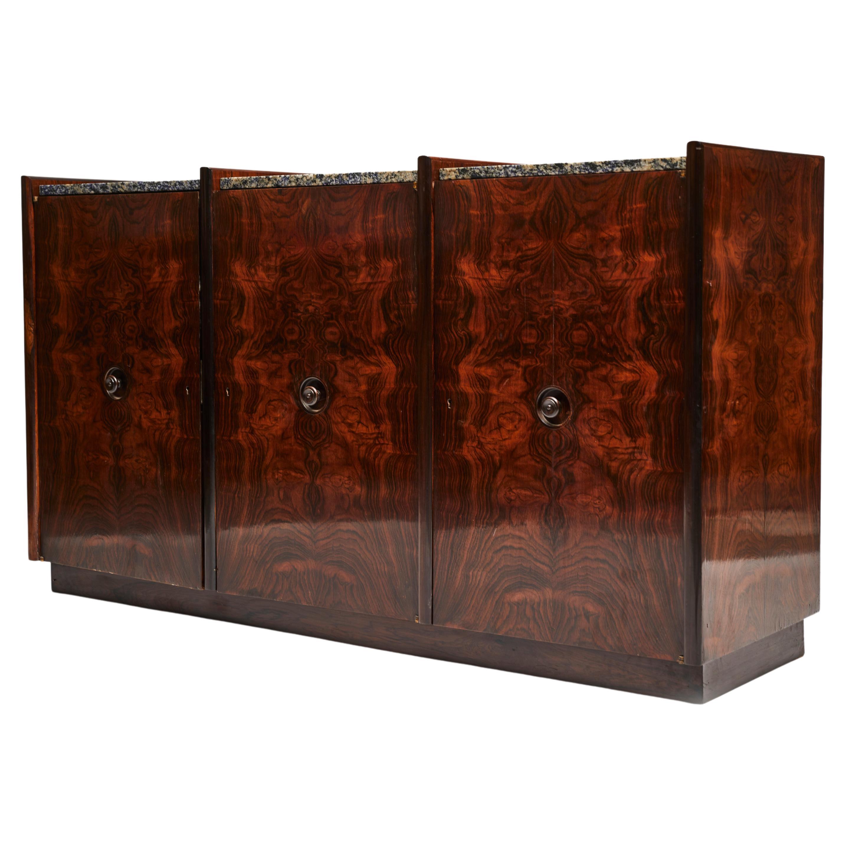 Available now, this Brazilian Modern credenza & room divider in hardwood and blue granite made in the 1960s in Brazil is nothing less than spectacular!

This exquisite piece is made in old Brazilian Rosewood (known as Jacaranda), Granite and is