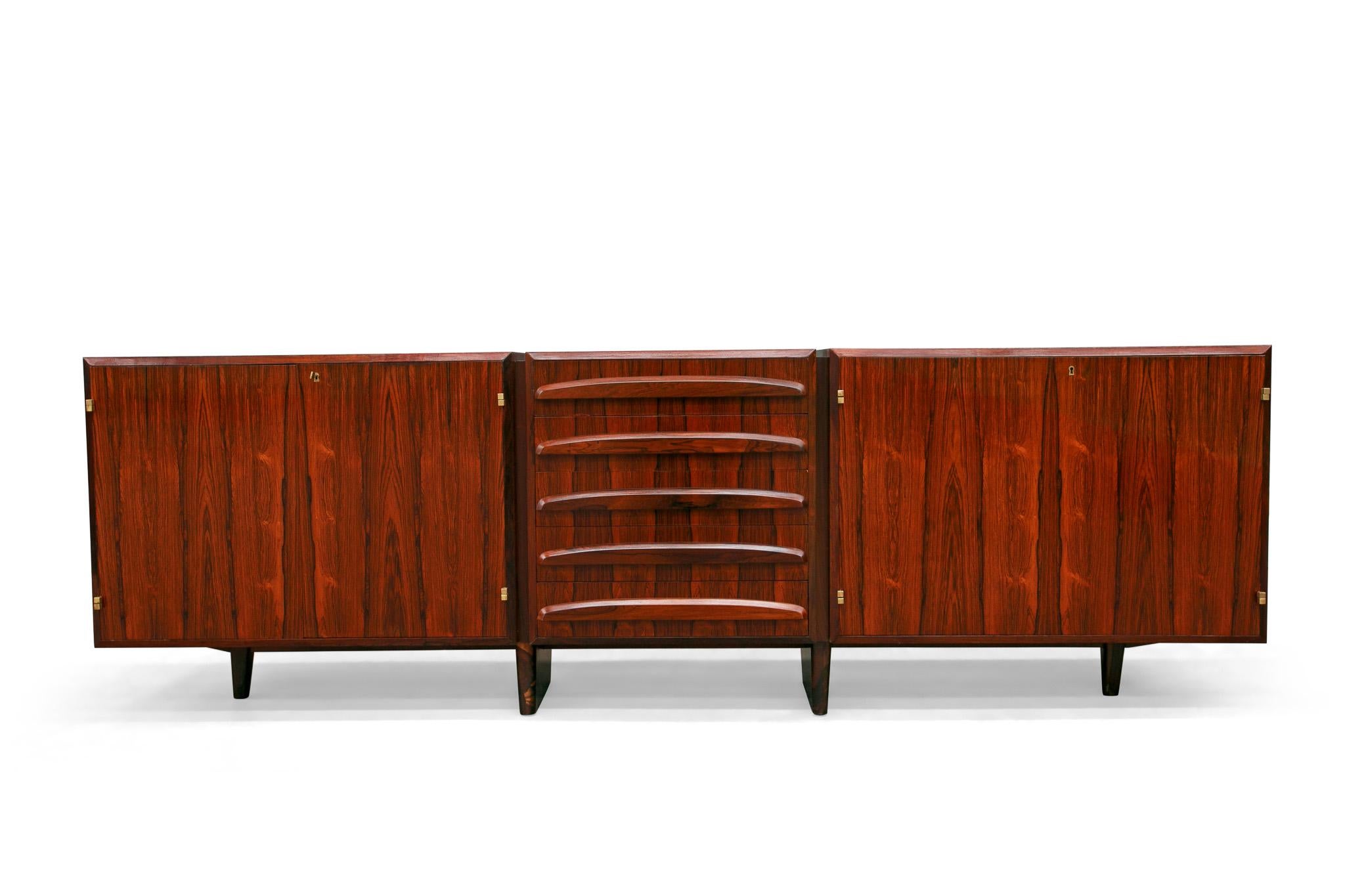 Available today, this Mid-Century Modern Credenza in Hardwood with Brass finishes designed by Jean Gillon in the sixties in Brazil is the FIND of the year.

The credenza has a rectangular structure made of Brazilian Rosewood, known as Jacaranda,
